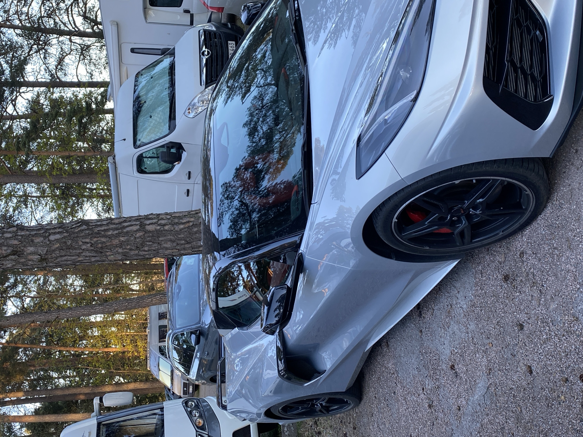 Silver Corvette C8 spotted among RVs in Uppsala parking area