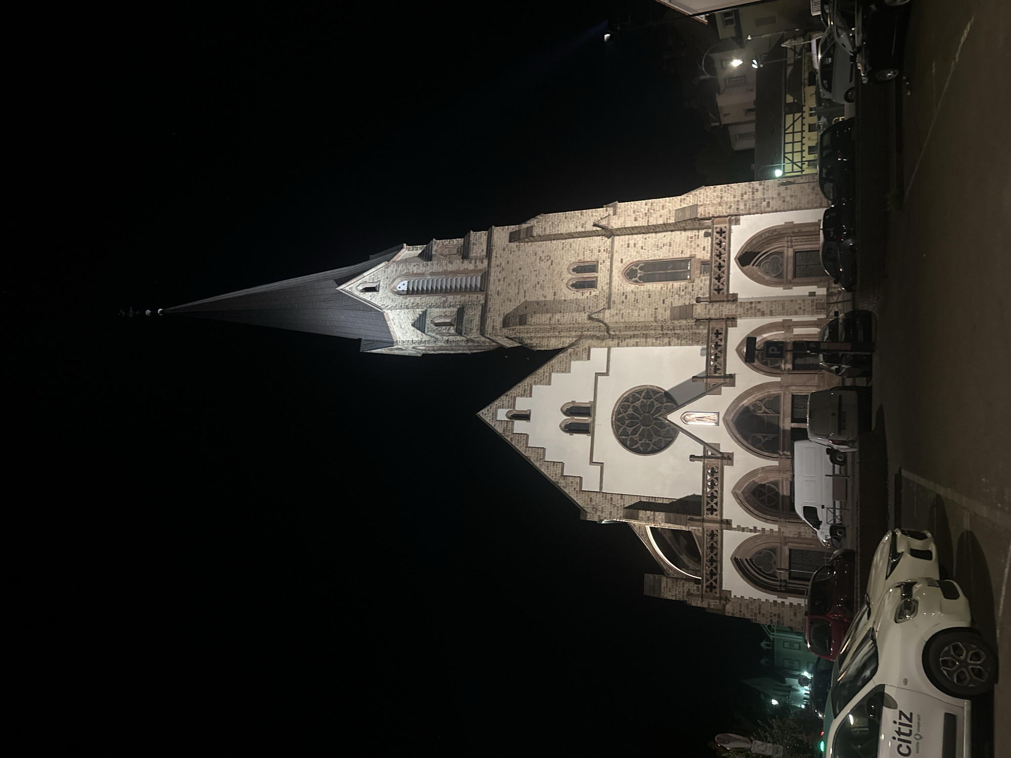 Église Saint Laurent illuminated at night in Bischheim