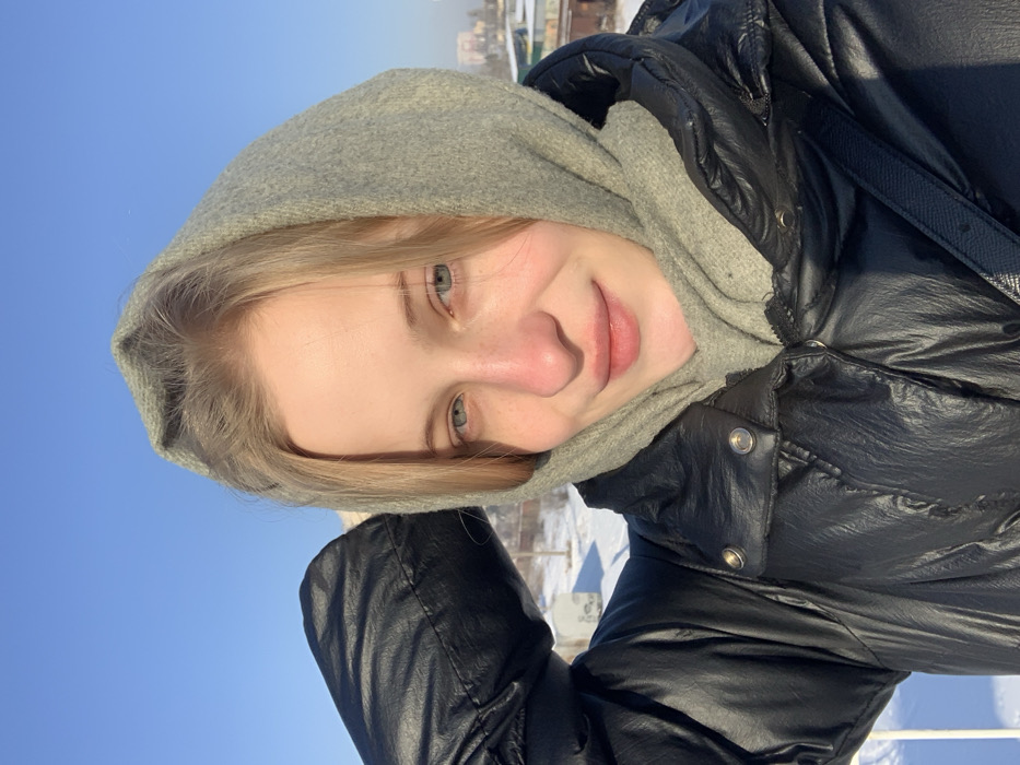 Young woman takes winter selfies in sunny Kyiv