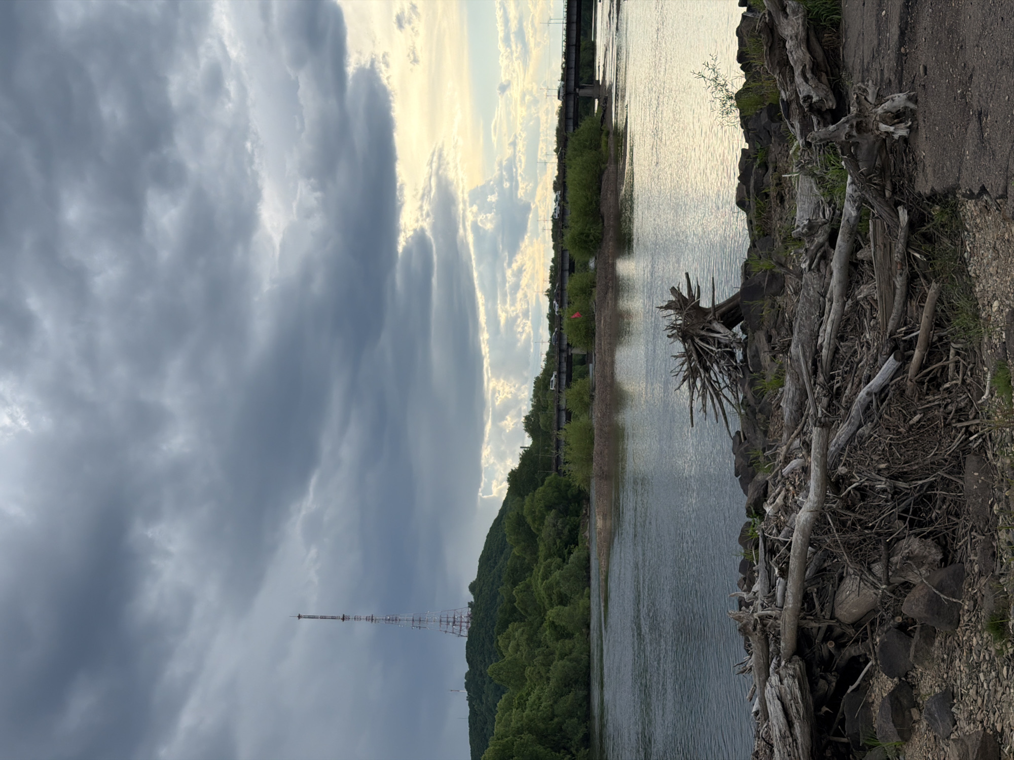 Woman photographs dramatic riverside scenery in Birobidzhan, Russia
