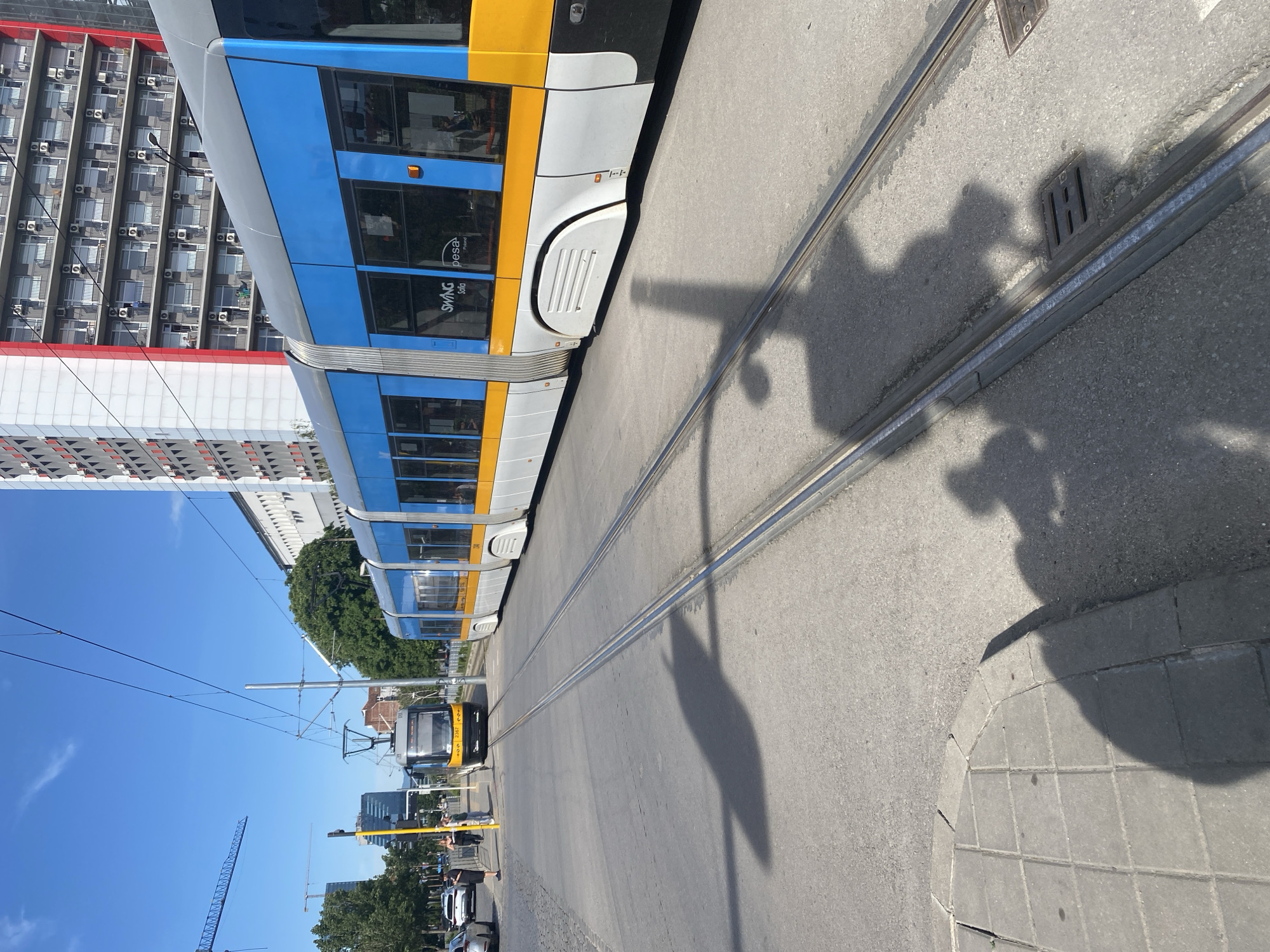 Sofia street scenes captured: tram service, sidewalks, overflowing bins