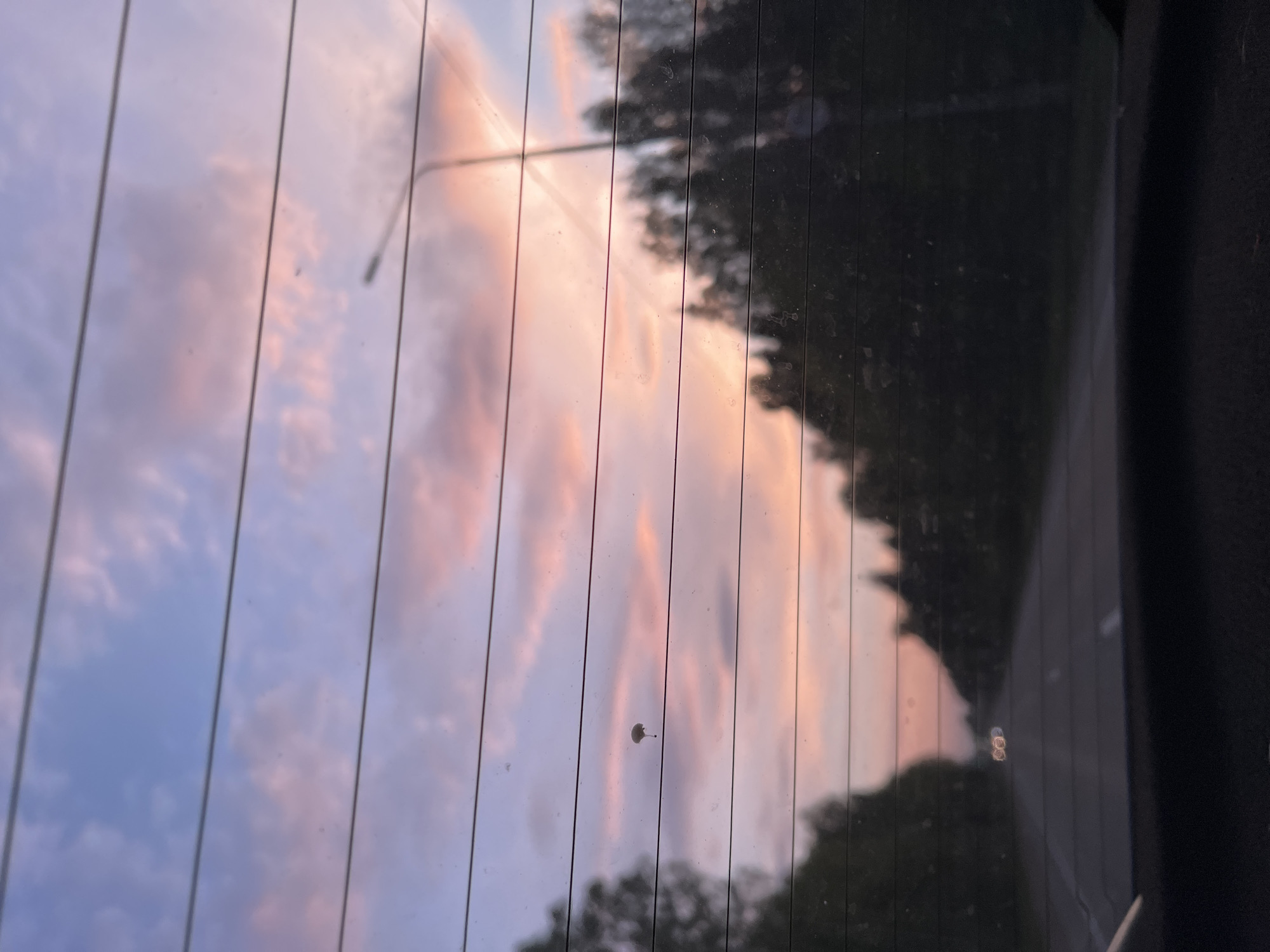 Motorist captures pink-blue sunset sky in rural Russia