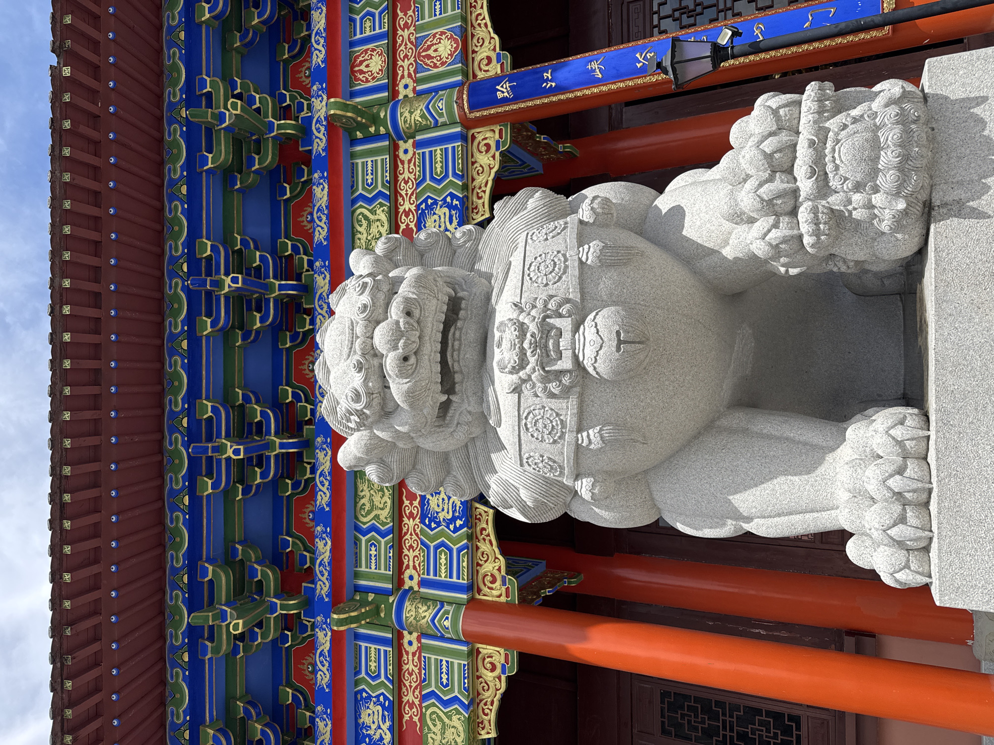 Tourist documents traditional temple architecture in Qianjiang, China