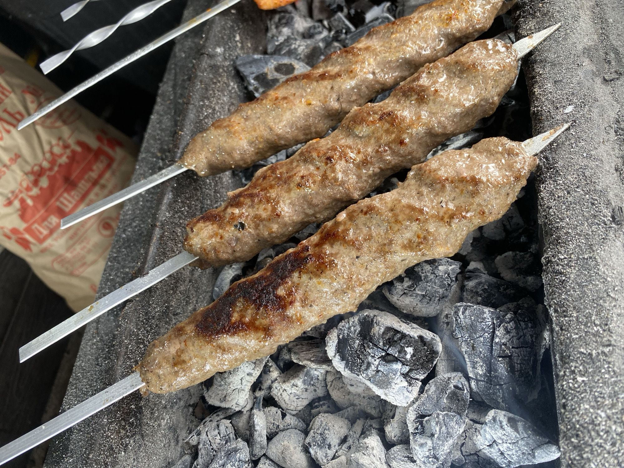Almaty street life: transit, markets, and grilling kebabs