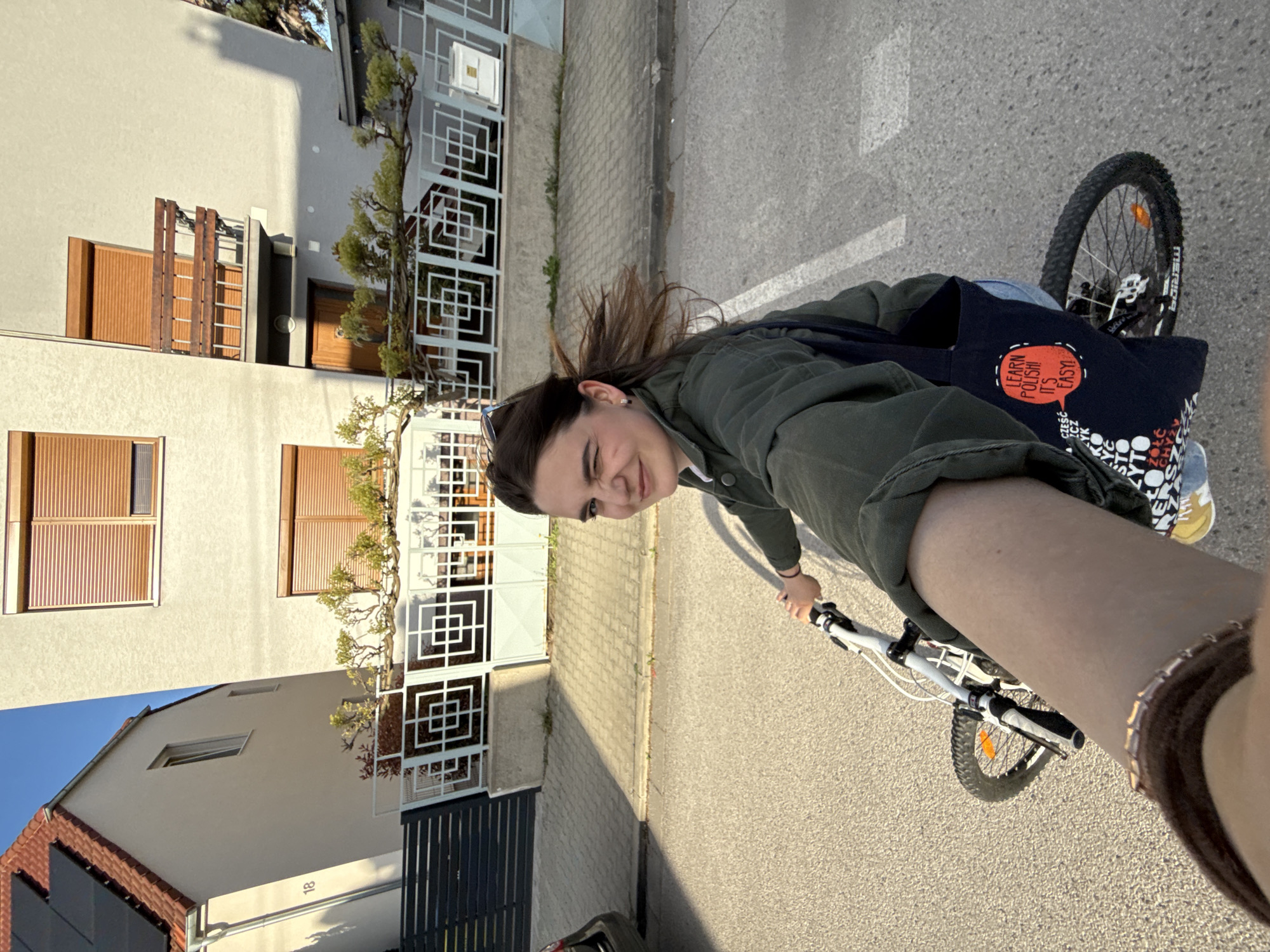 Woman cycles through Trnava streets, documented in multiple perspectives