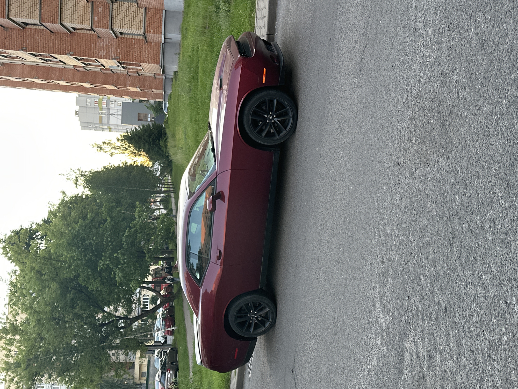Maroon Dodge Challenger and street scenes documented in Minsk