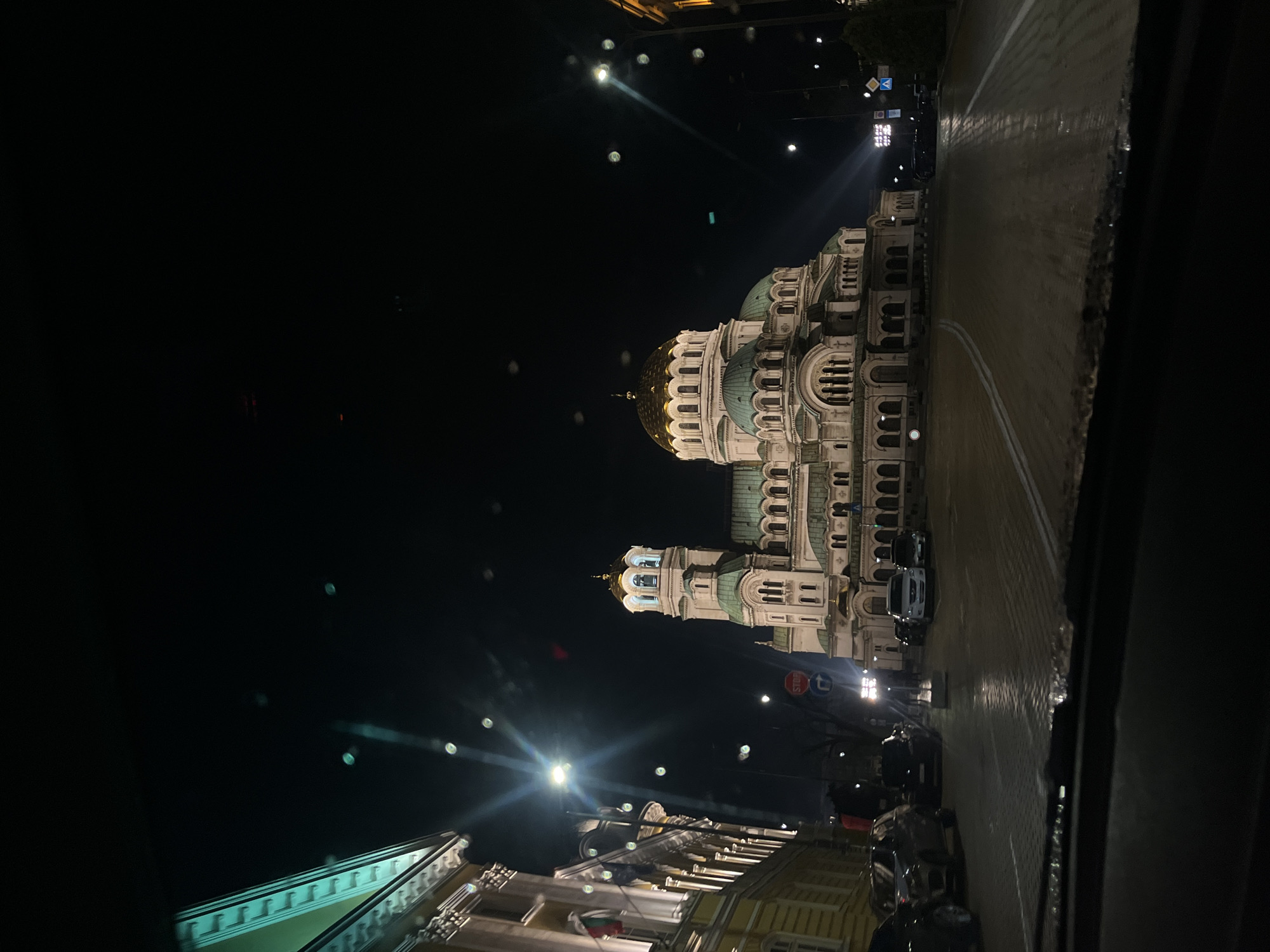 Evening drive captures illuminated Sofia landmarks and Ferris wheel