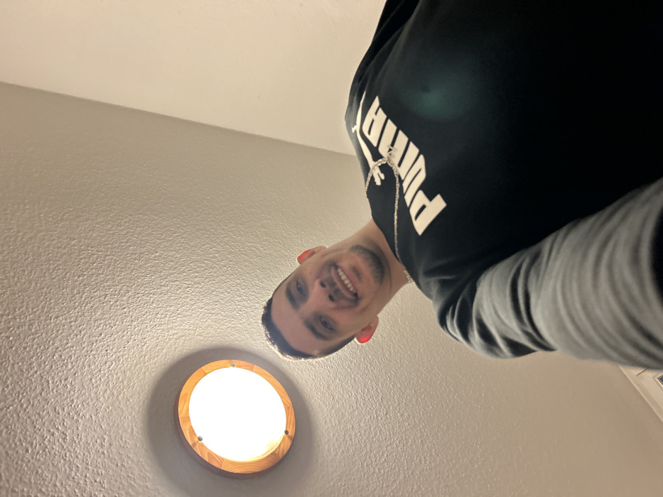 Man documents currency collection and team memorabilia in Bischheim selfies
