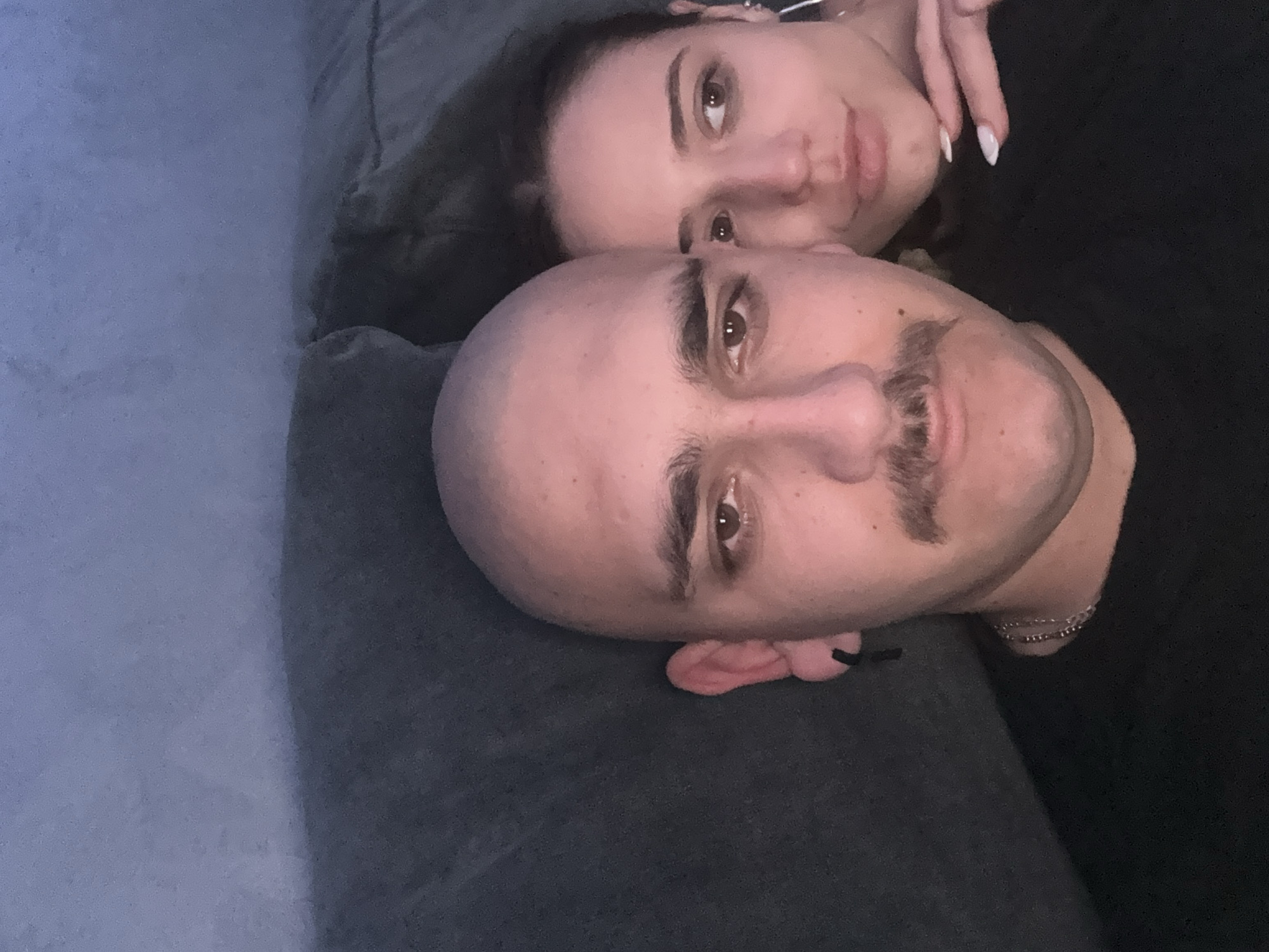 Couple photographed resting on couch in Pernik, Bulgaria
