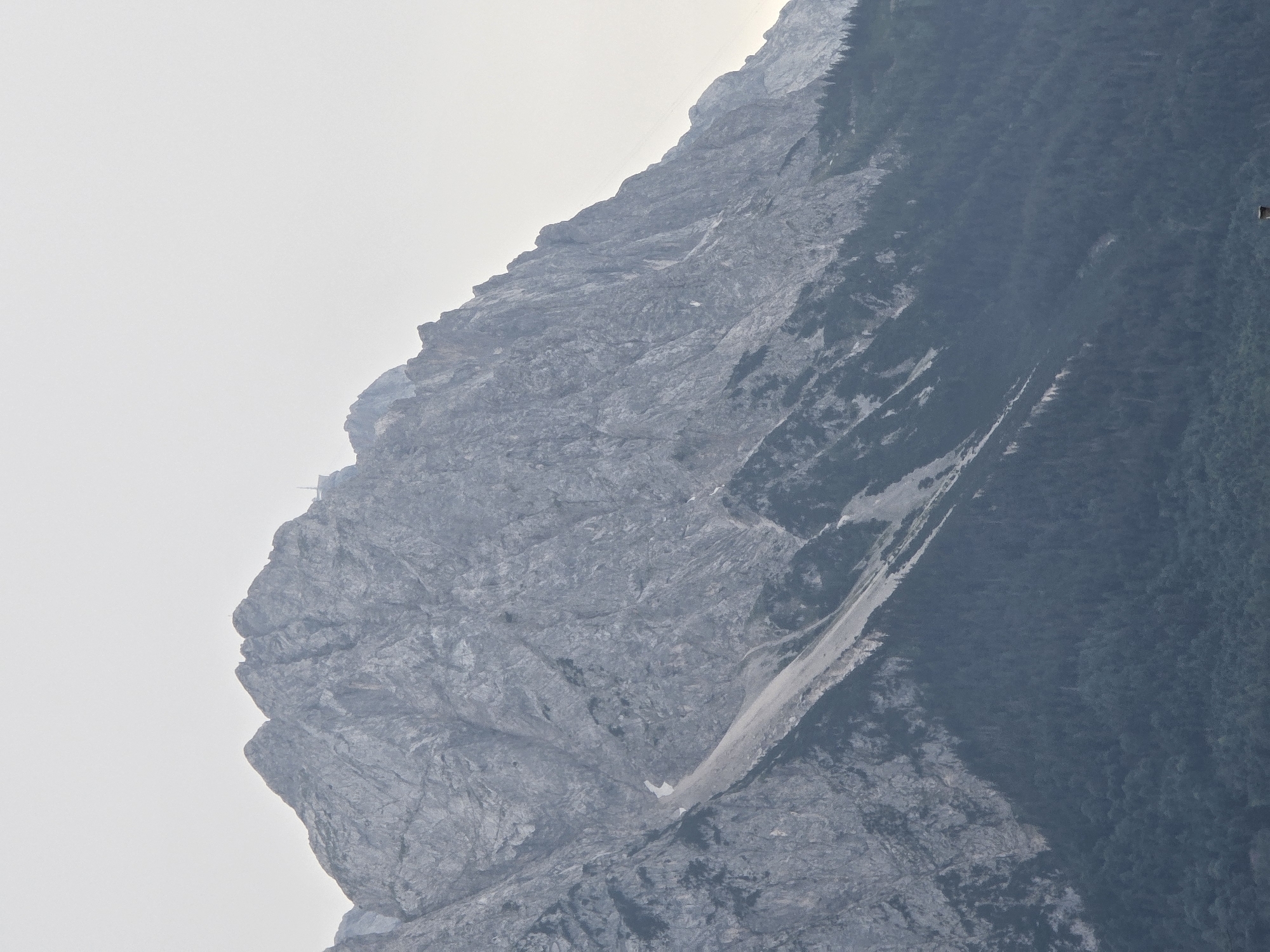 Garmisch-Partenkirchen from rooftop to ridgeline, dusk closing in