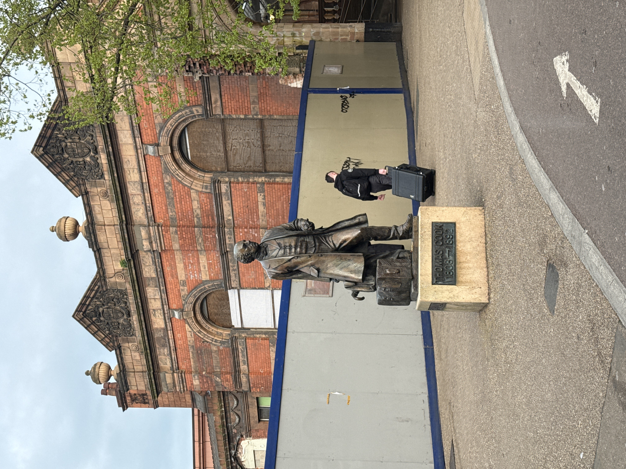 Historic Leicester station building documented under overcast afternoon skies
