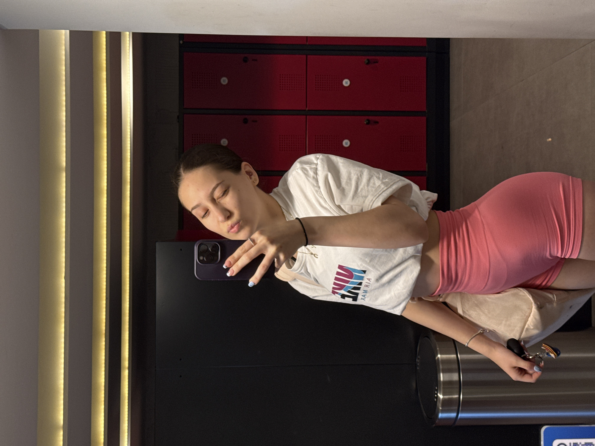 Woman takes selfie in Sofia gym locker room