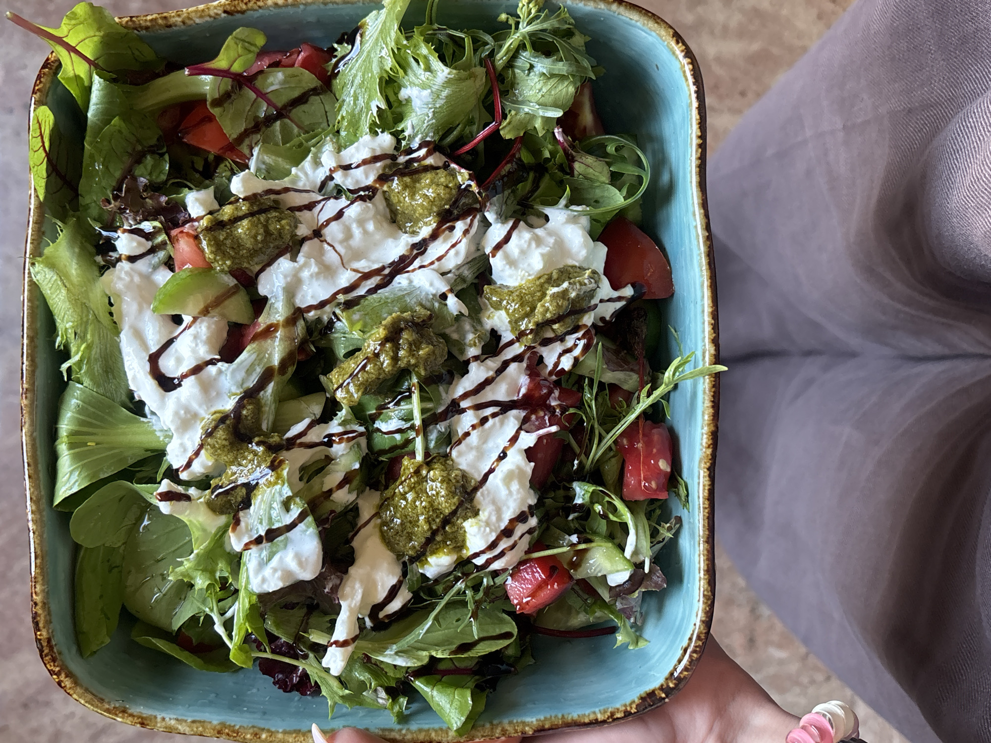 Person enjoys salad lunch in Yerevan, Armenia