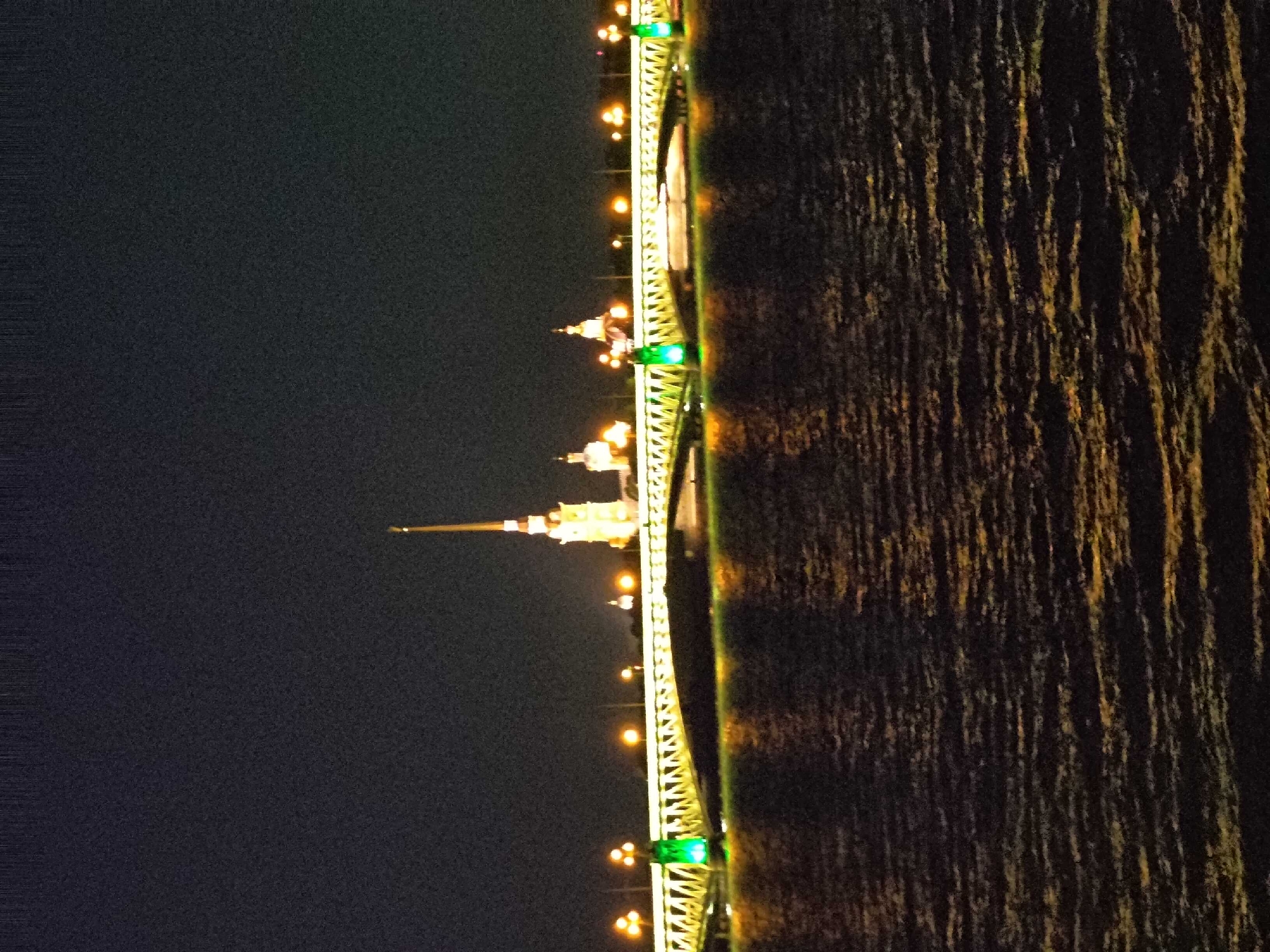 Saint Petersburg at night: Neva bridge lights and neoclassical sculpture