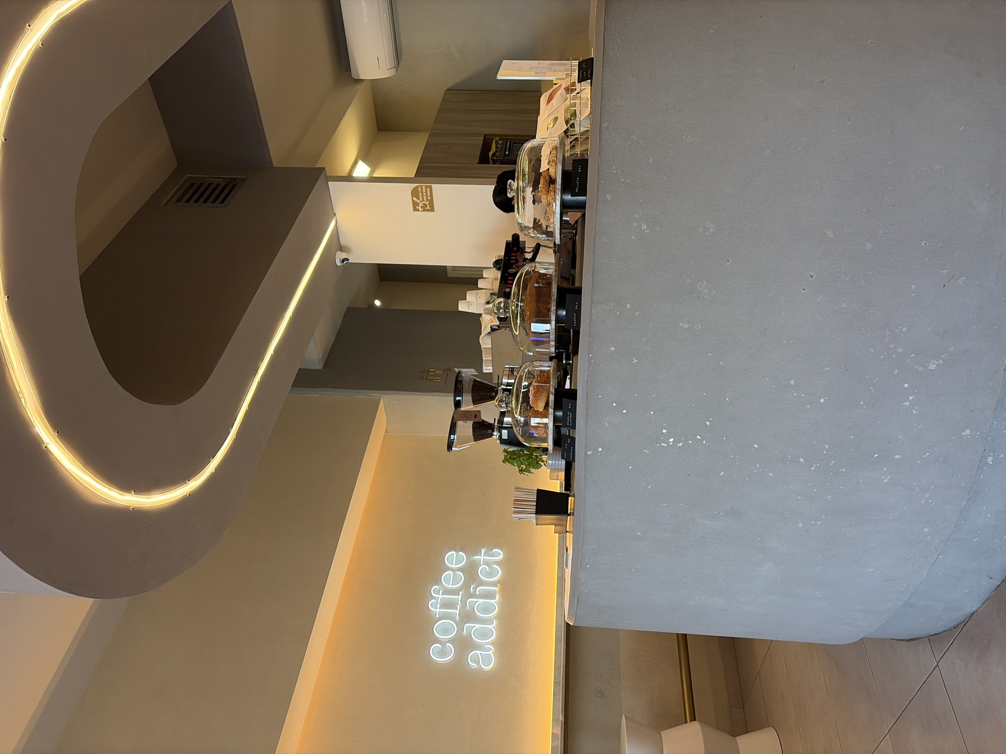 Modern minimalist coffee shop interior documented in evening hours