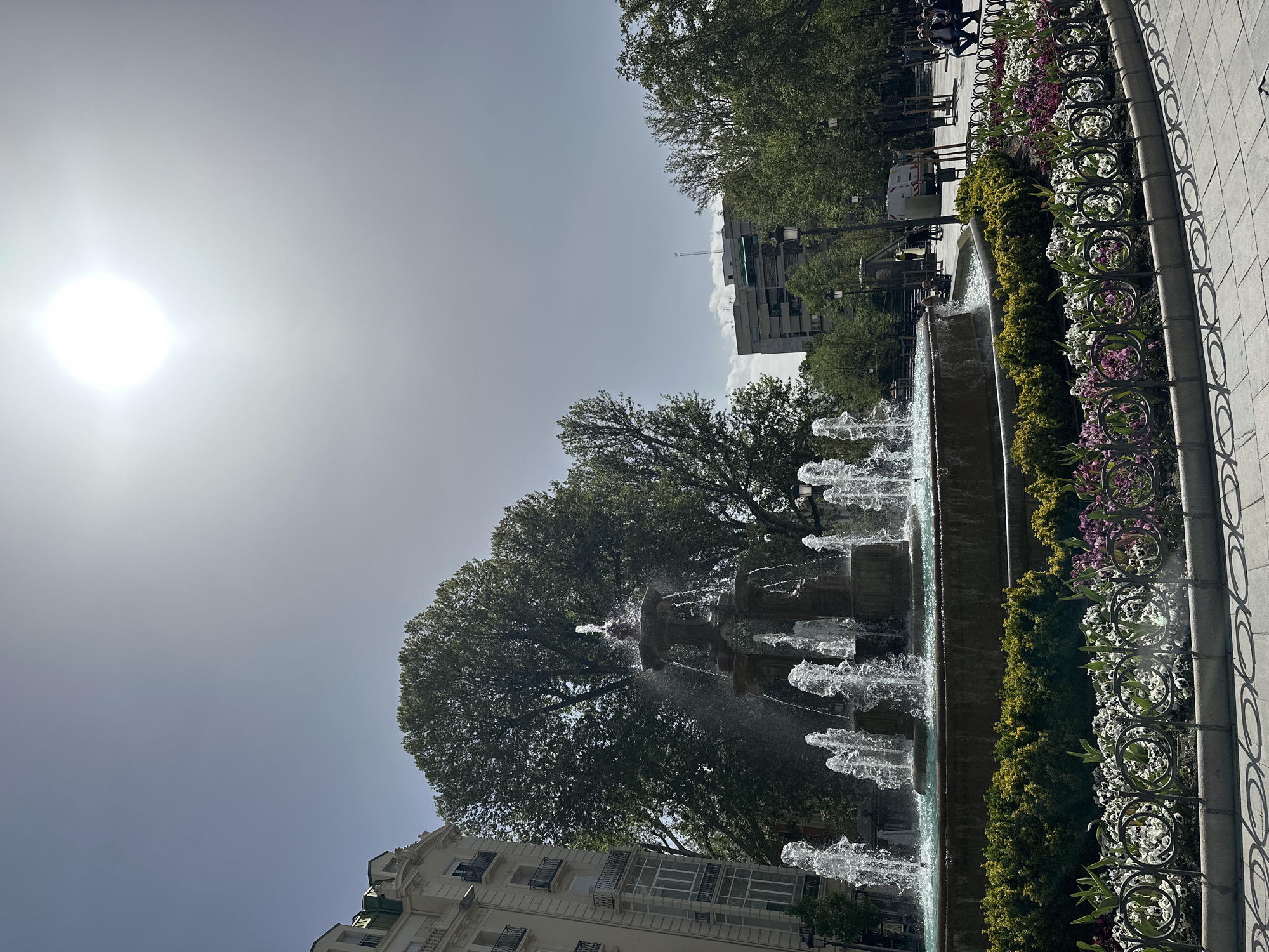 Tiered fountain observed in bright sunlight in Granada, Spain