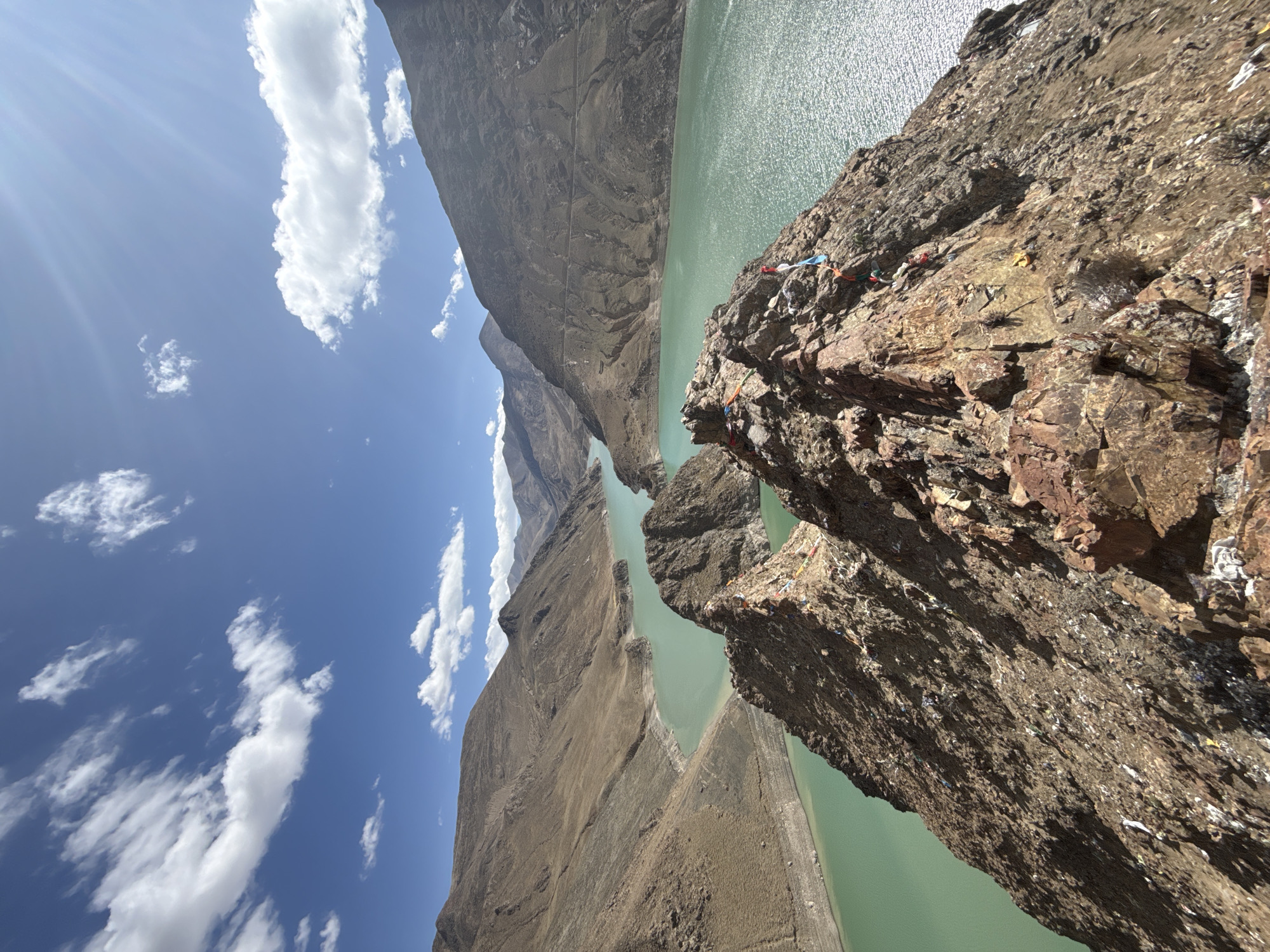 Hiker Documents Turquoise Mountain Lake Views in Tibet