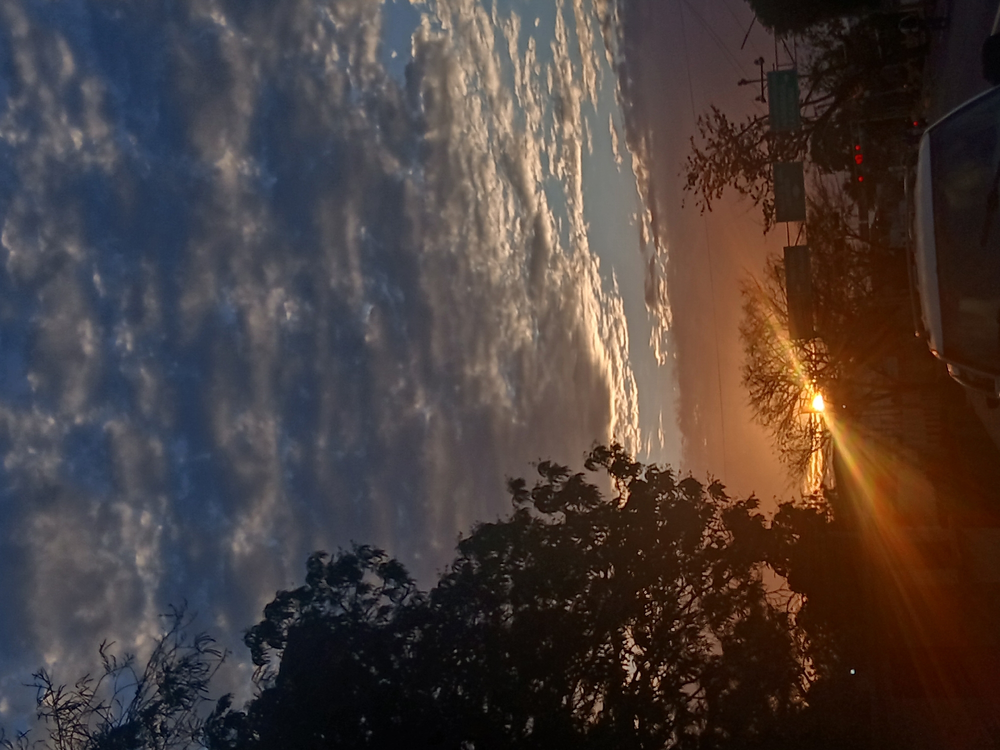 Dramatic sunset with layered clouds observed in Juan Griego