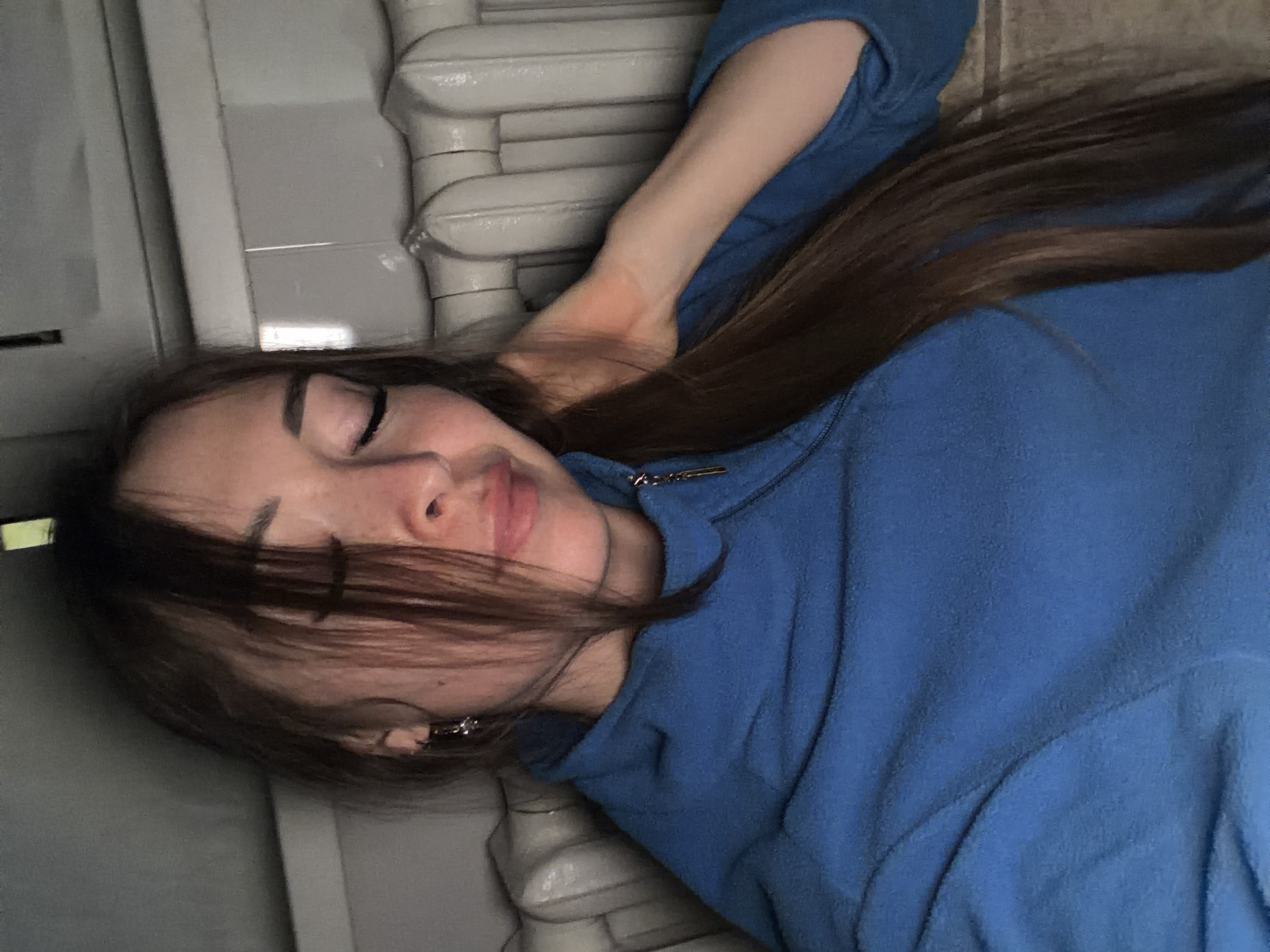 Resting indoors in a blue hoodie, Япрыково