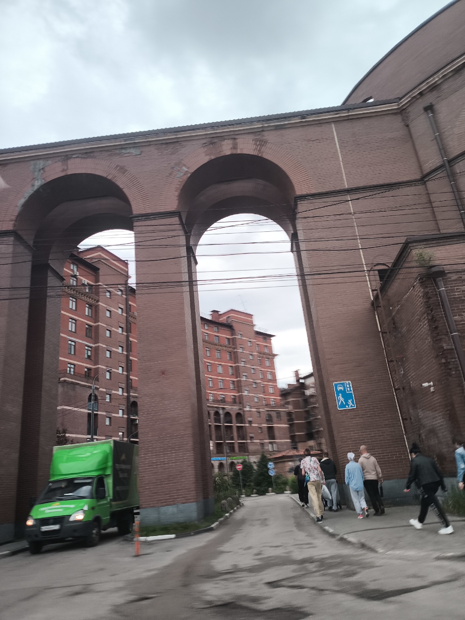 Afternoon scenes around brick buildings and riverside restaurant area