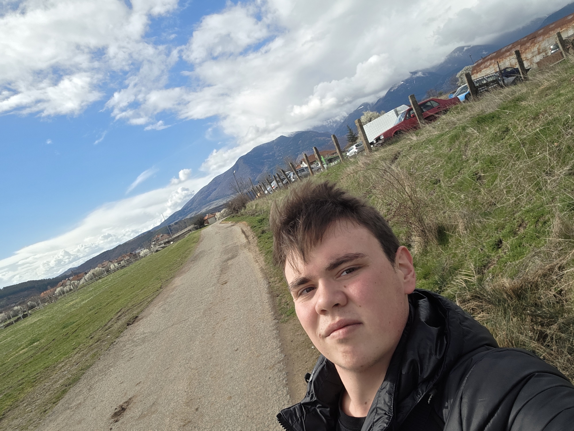 Young man photographed in rural Yahinovo during spring afternoon
