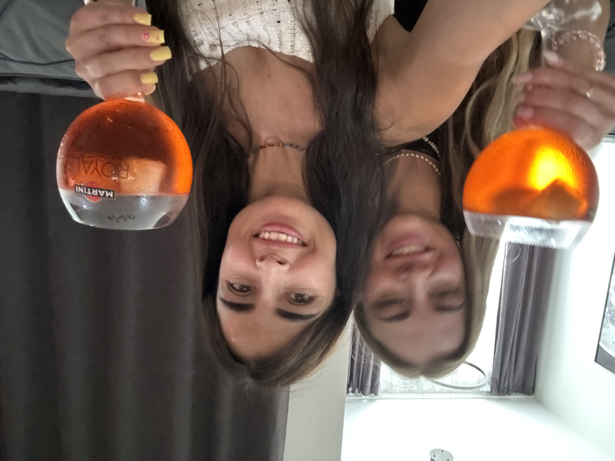 Orange aperitivo drinks and a charcuterie spread at a casual gathering