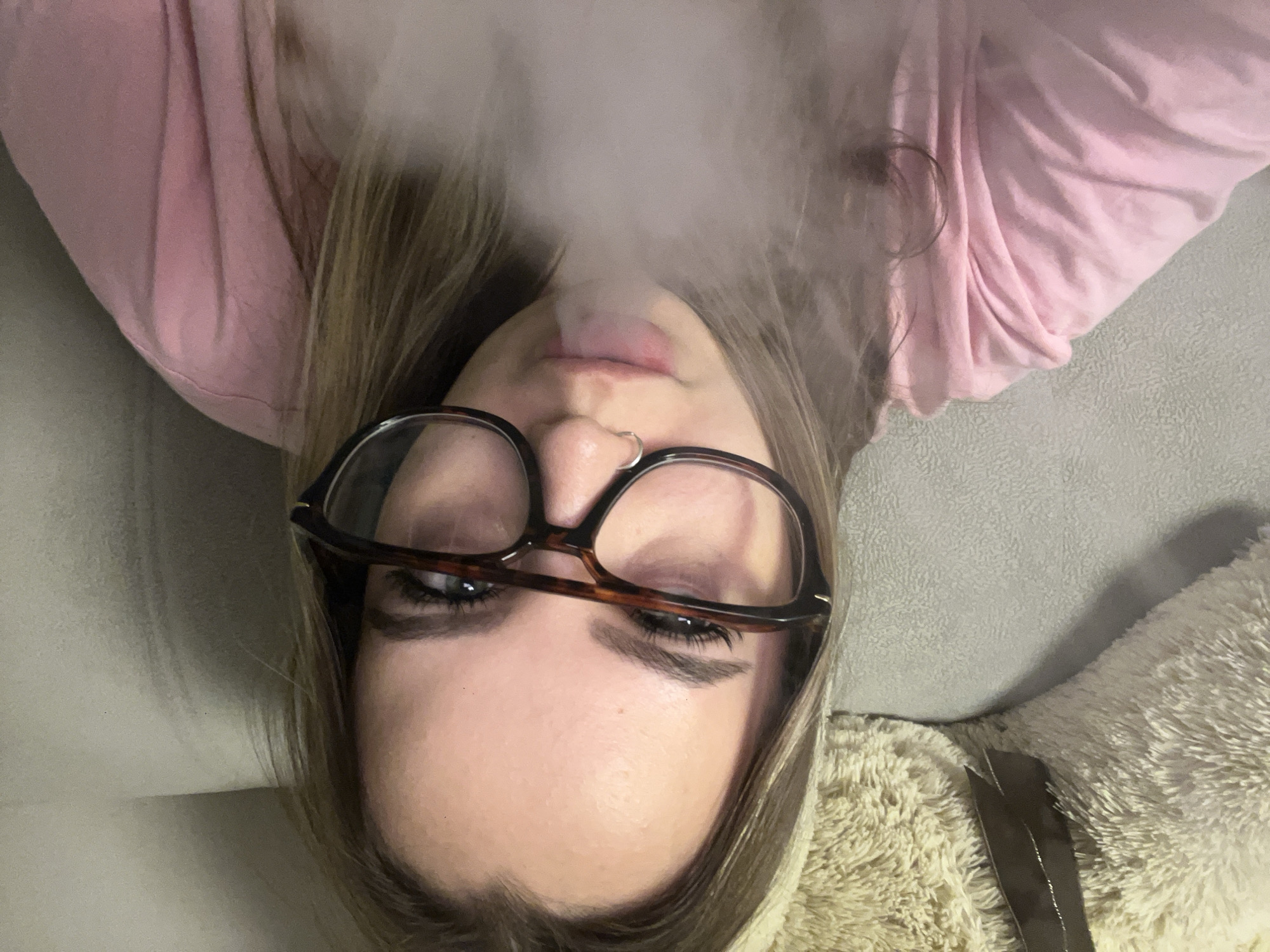 Woman smoking on couch observed in Krasnodar, Russia