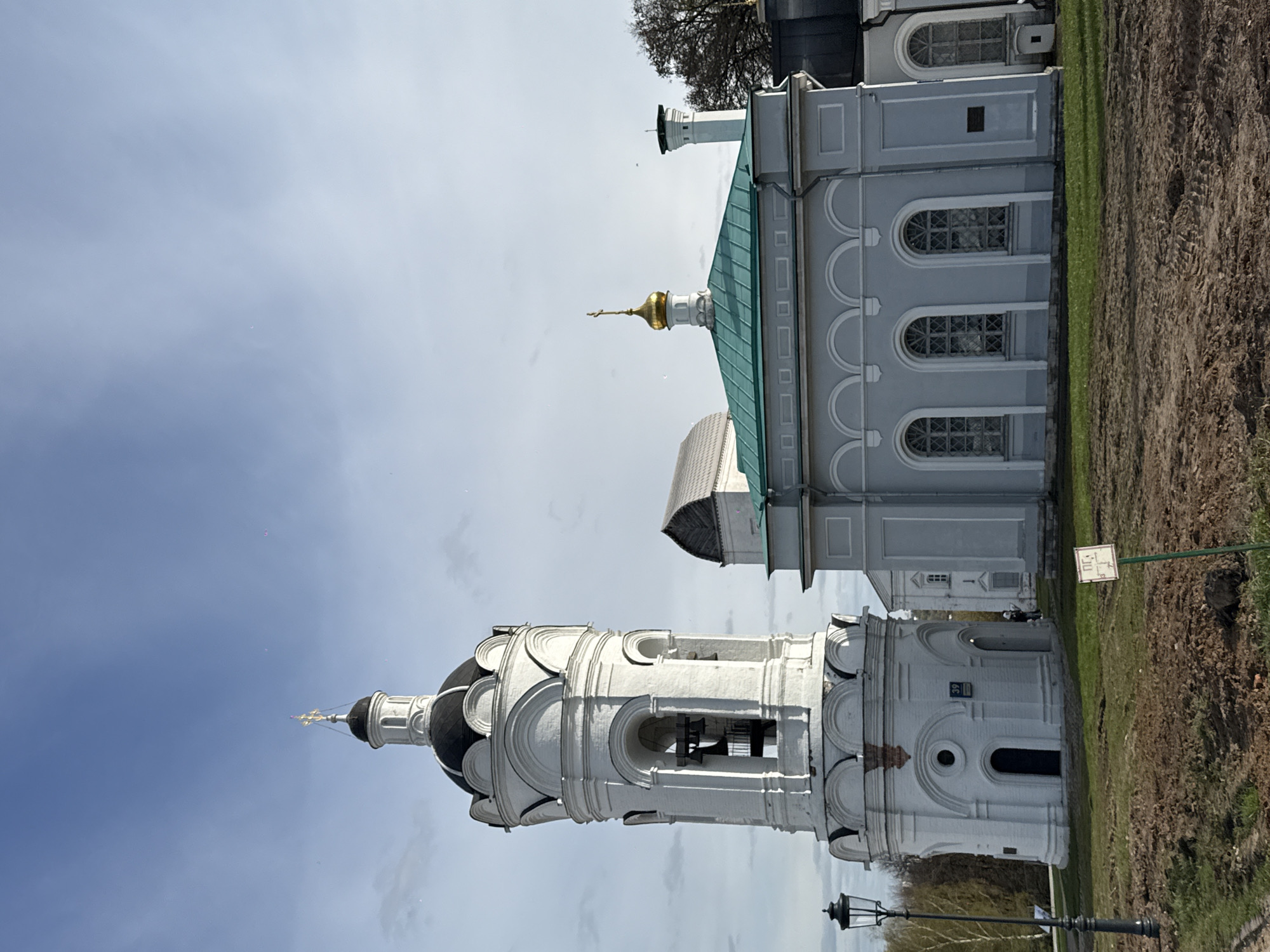 Tourists explore historic Russian Orthodox churches in Moscow park