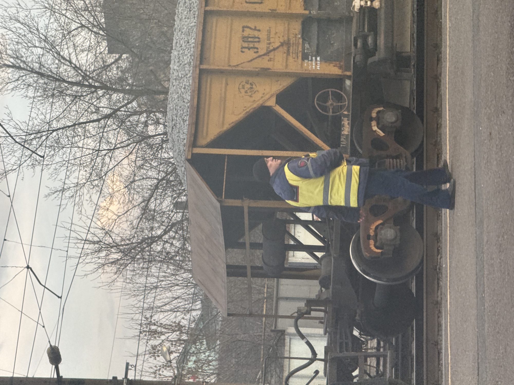 Rail worker inspects hopper car in Gryazi, Russia