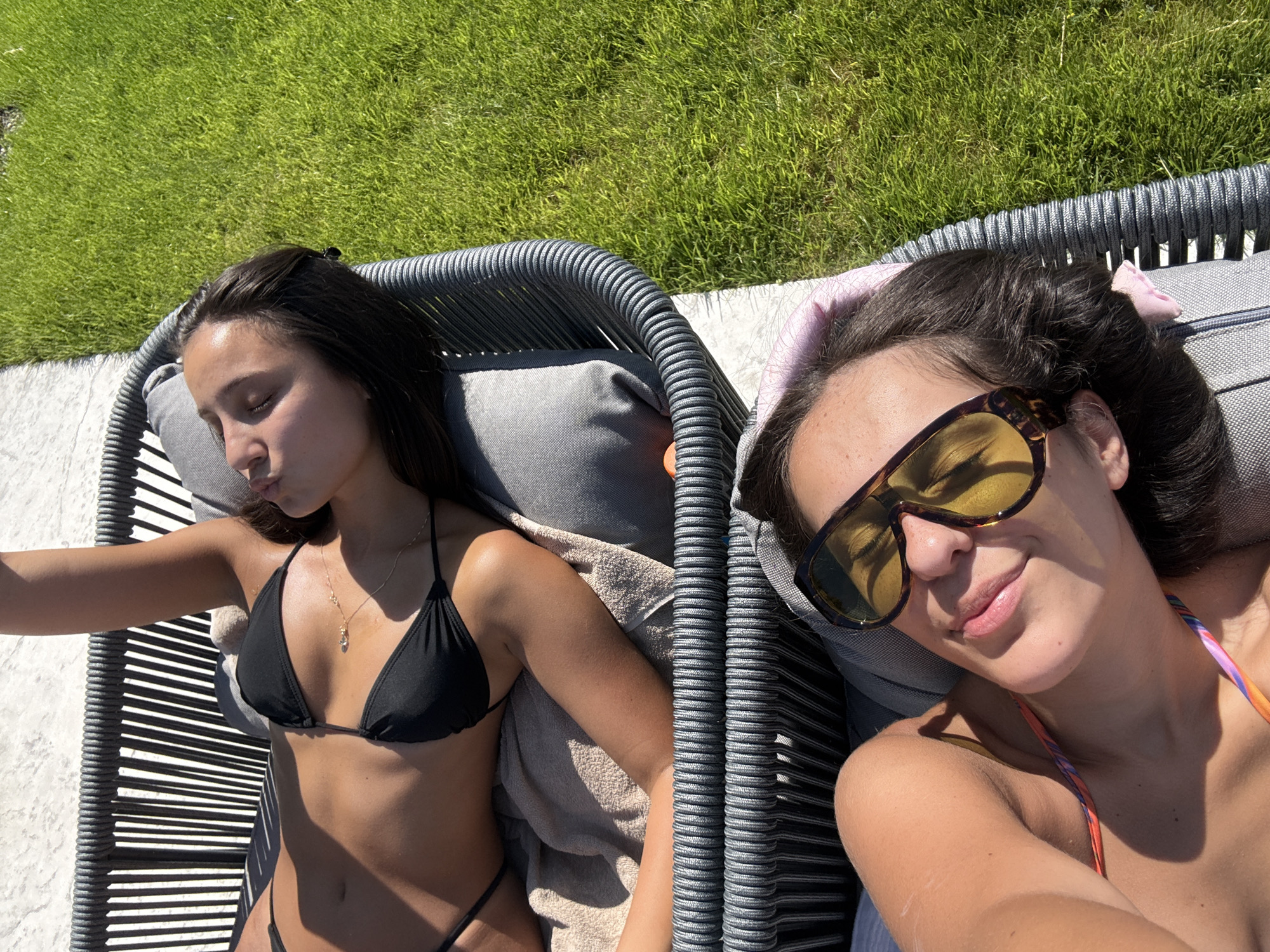 Two women relax poolside in Elenovo, Bulgaria