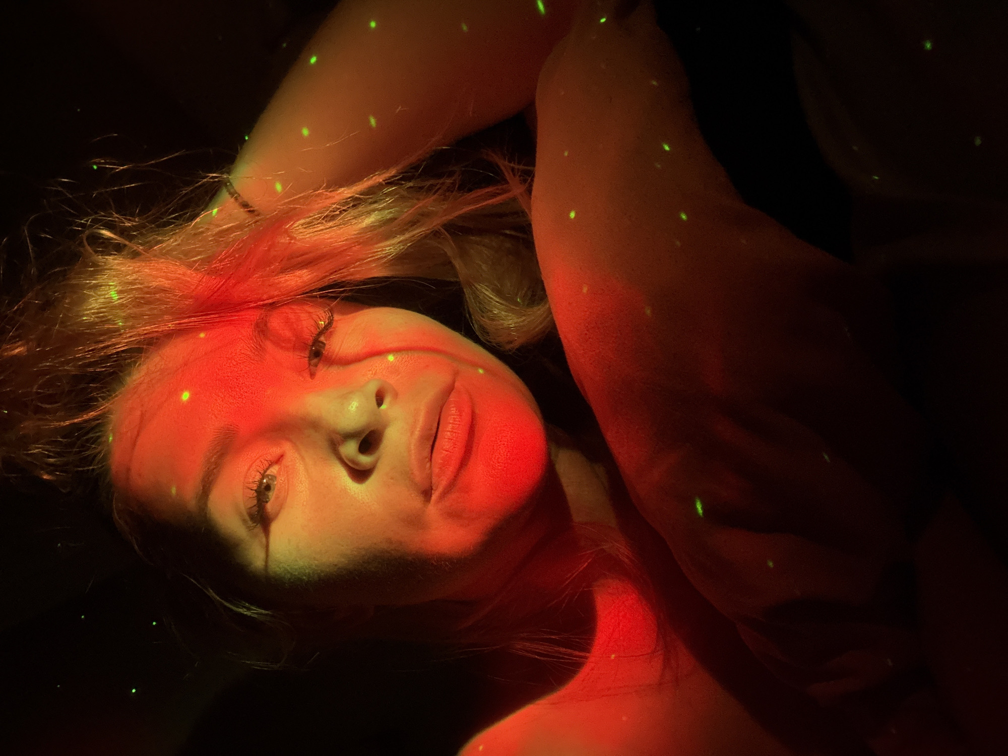 Woman photographed in colored light portrait session in Veliky Novgorod