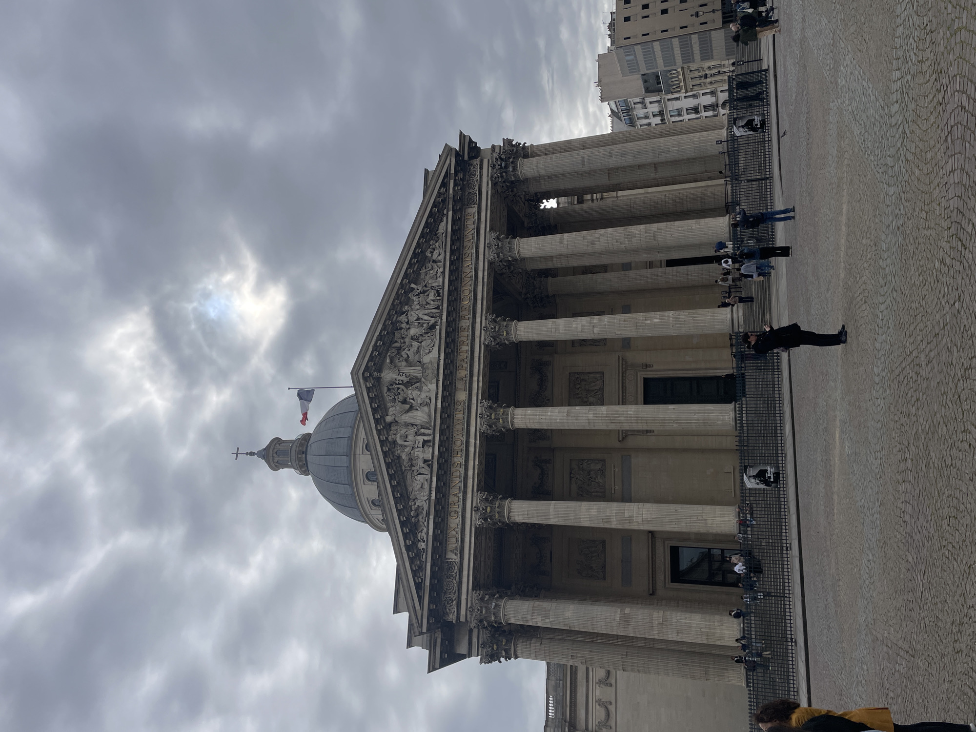 Panthéon observed with French flag and visitors in Paris