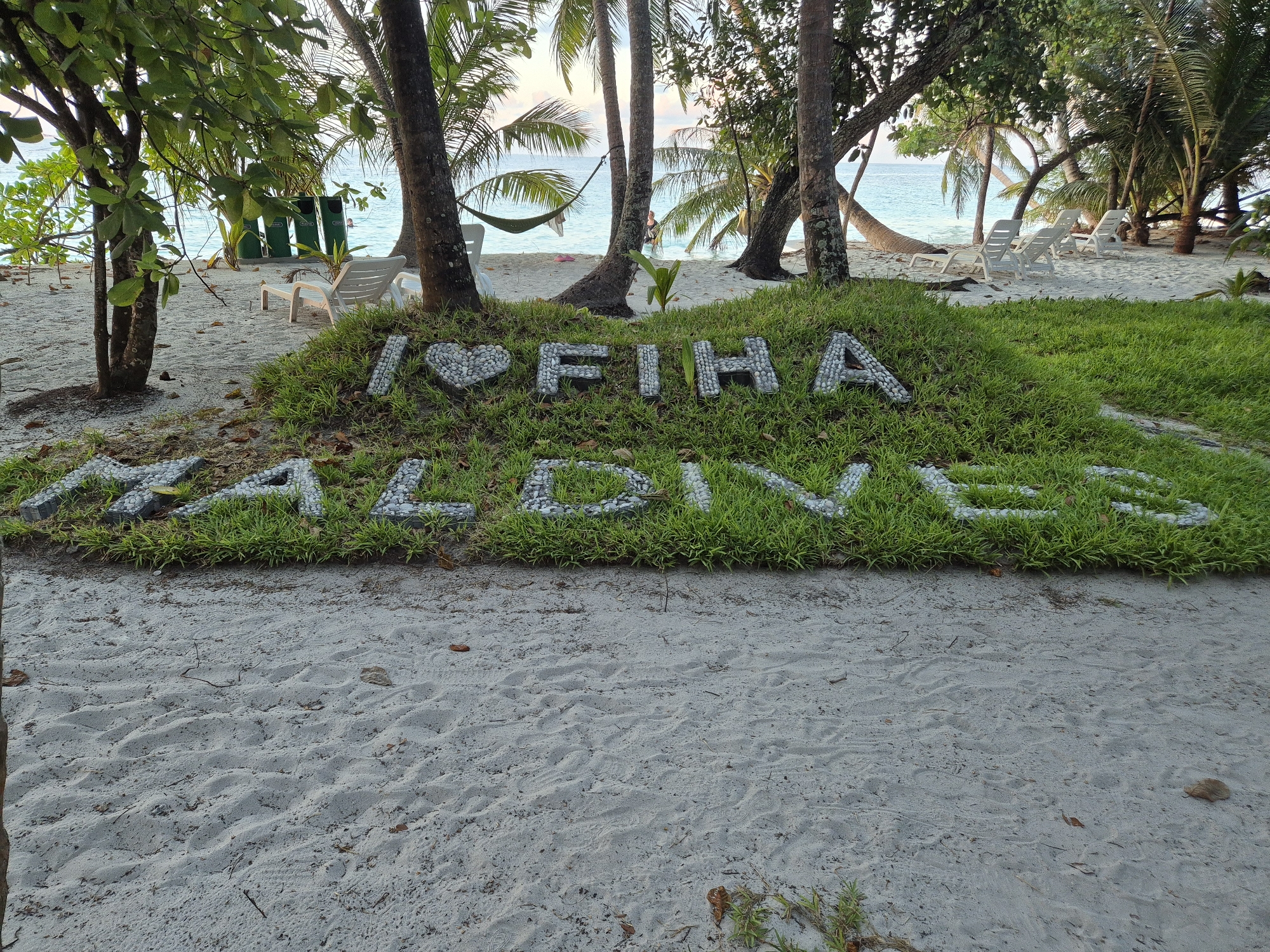 Love message spelled in pebbles on Maldives beach