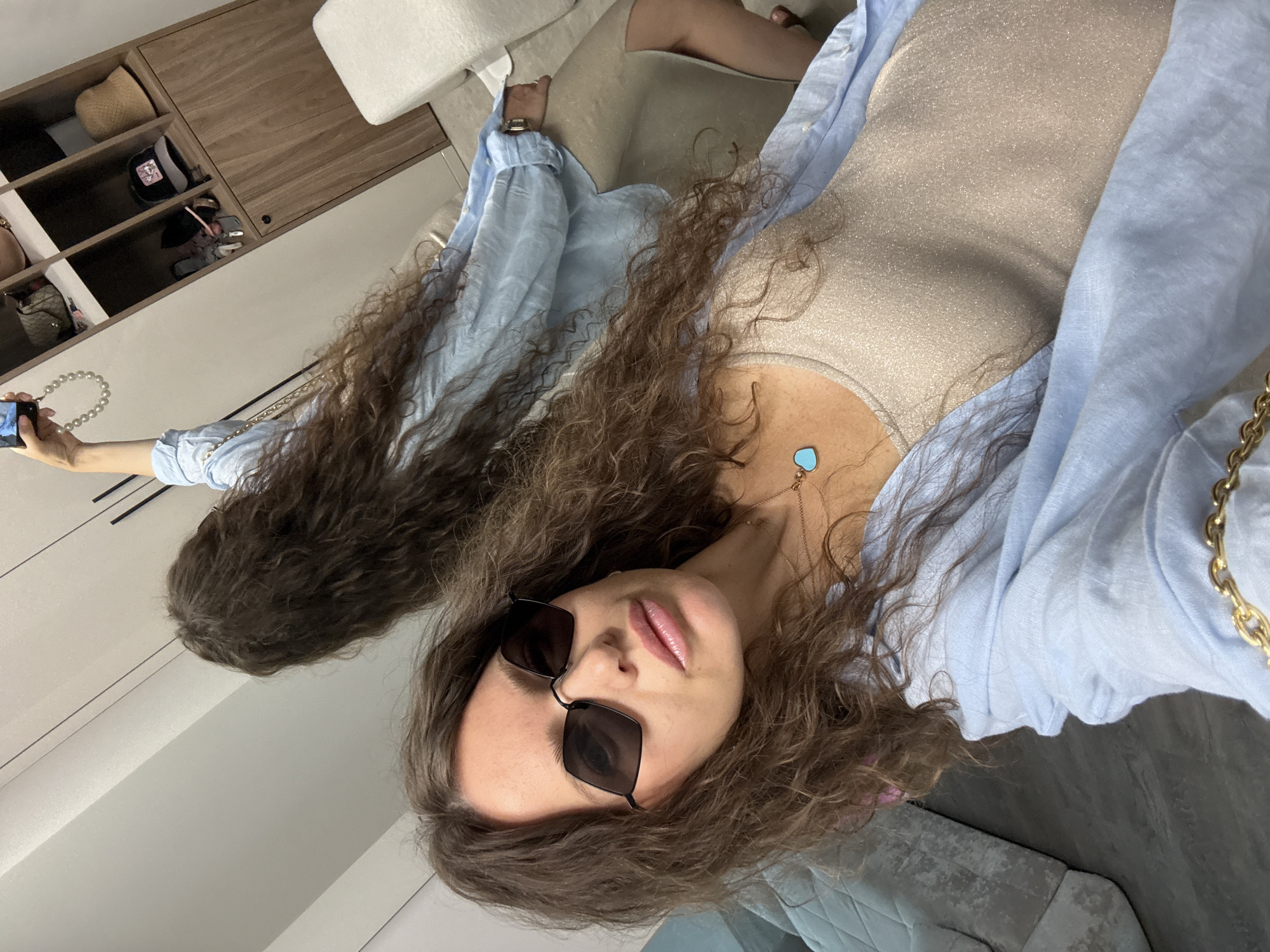 Mirror selfie session in a Khimki dressing area, outfit locked in
