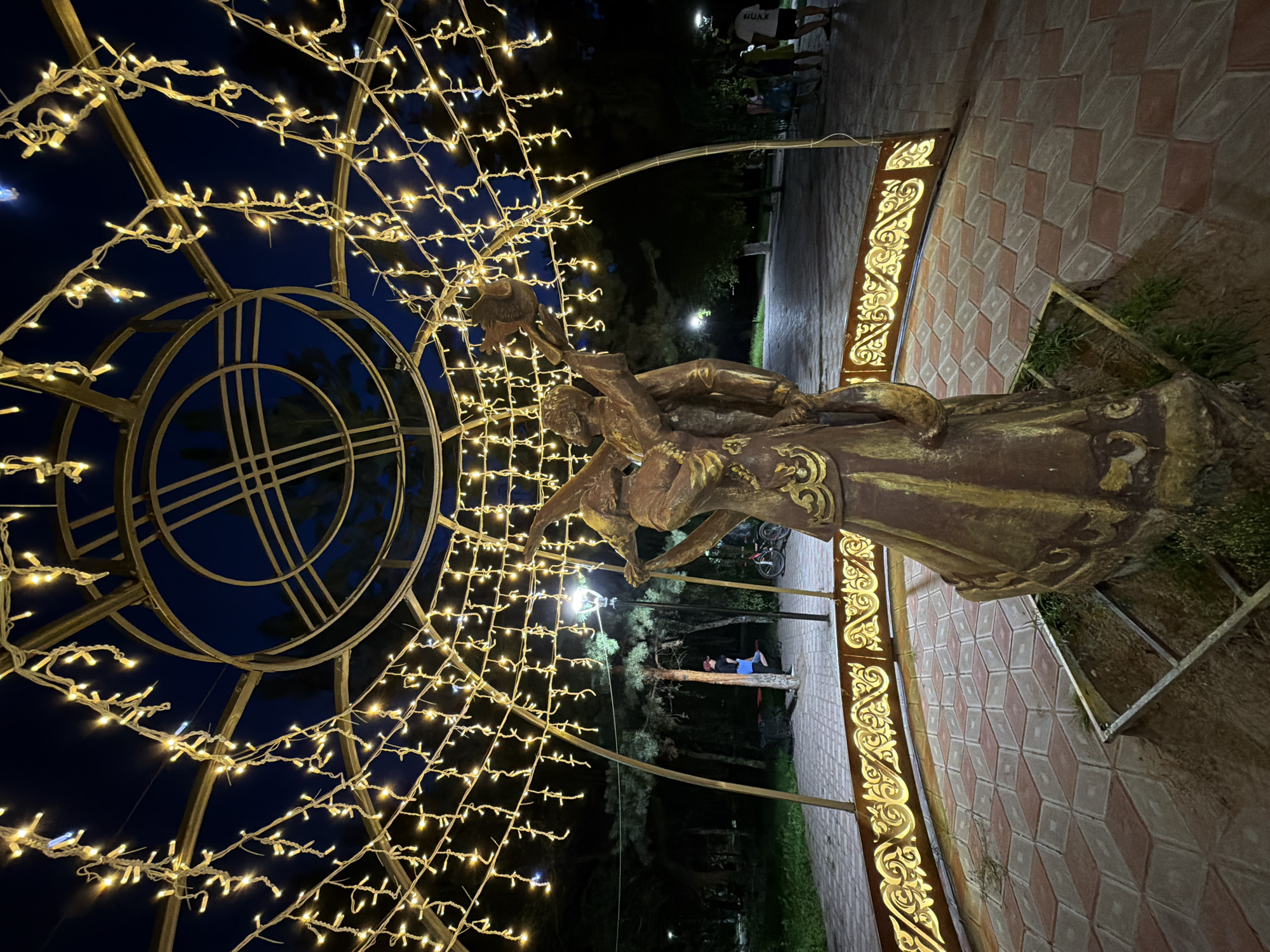 Pavlodar's romantic public art and nighttime streets.