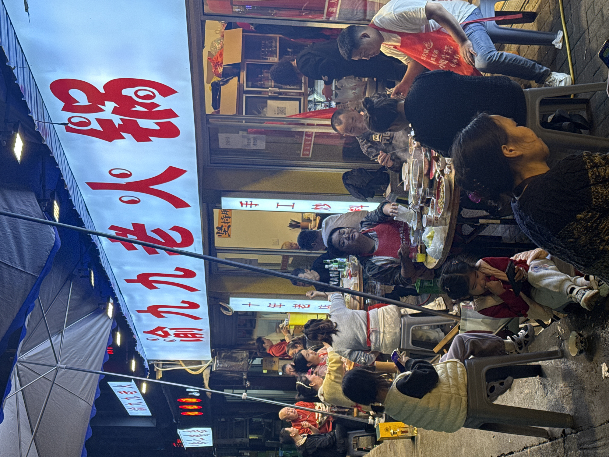 Street dining scene captures families at outdoor restaurants