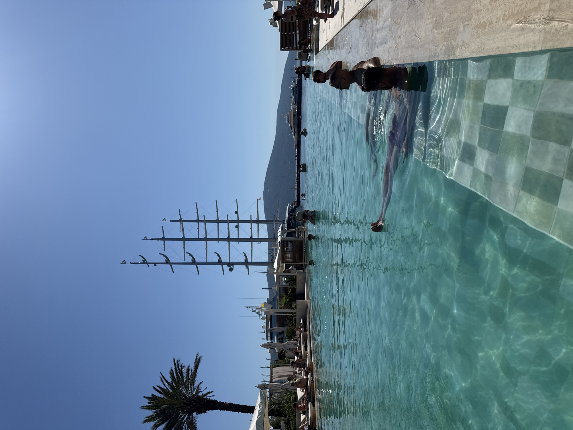 Swimmers enjoy sunny afternoon at Tivat infinity pool