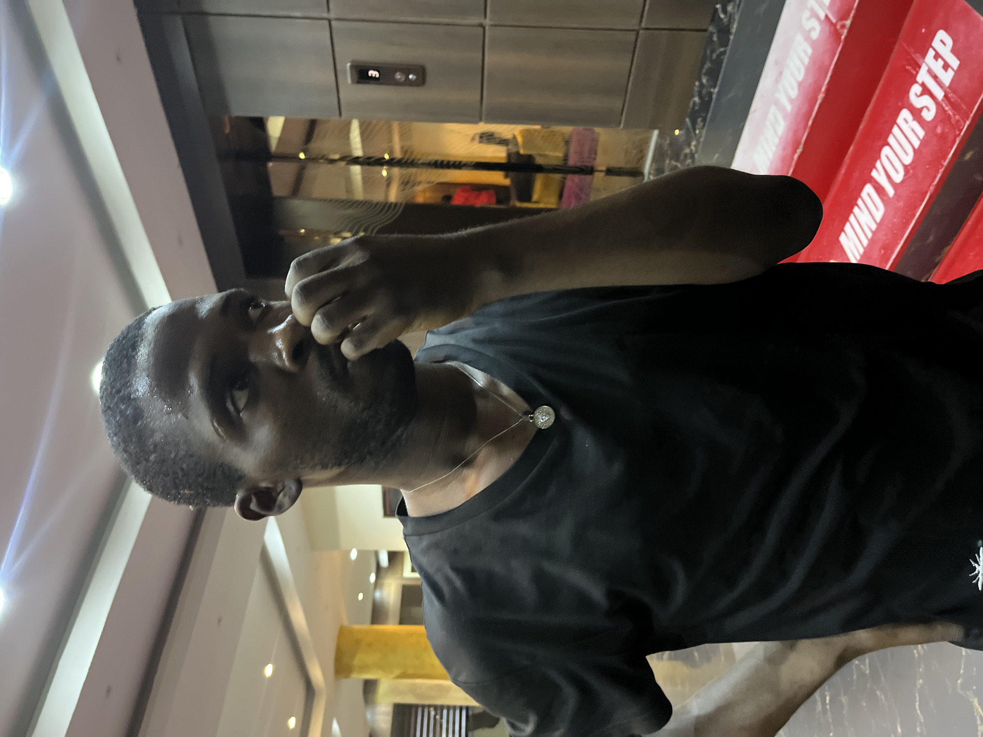 Evening out at an Abuja lounge, elevator selfies included.