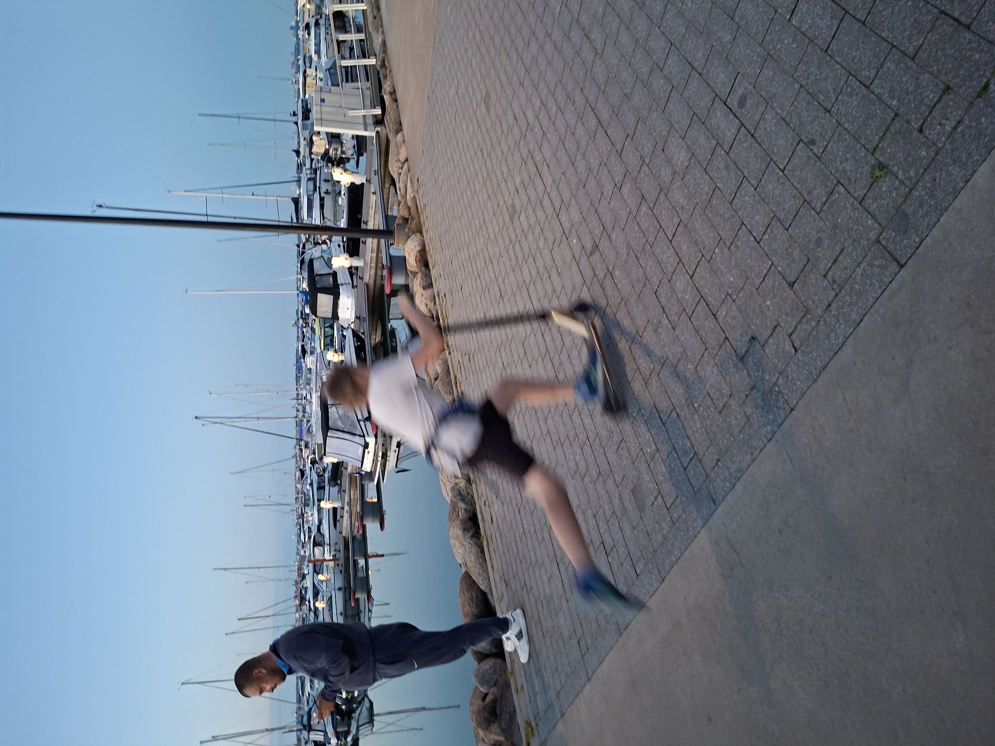 Evening stroll documented at Tallinn waterfront marinas during twilight
