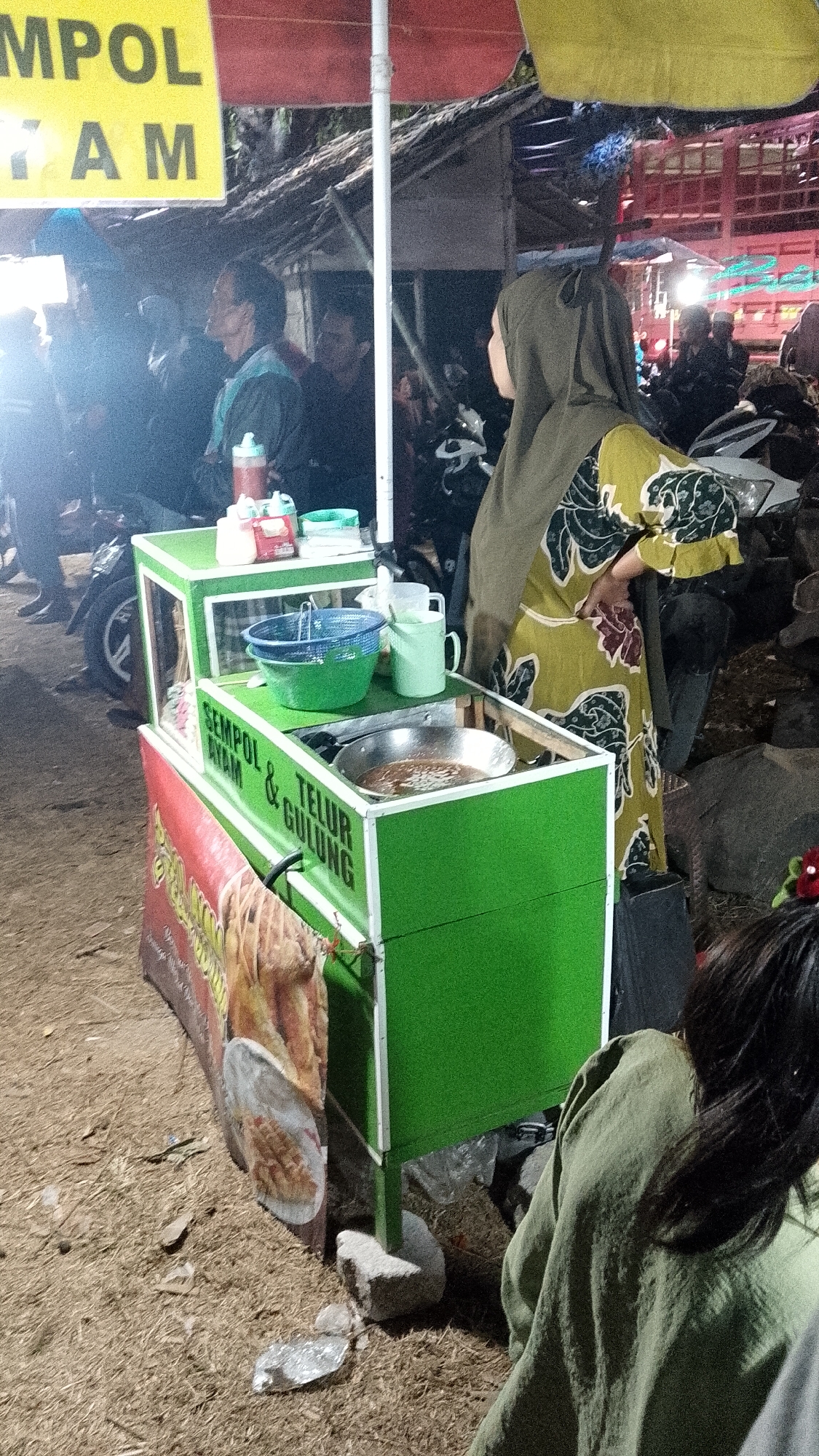 Night market buzz around food stalls in Mayang, Indonesia