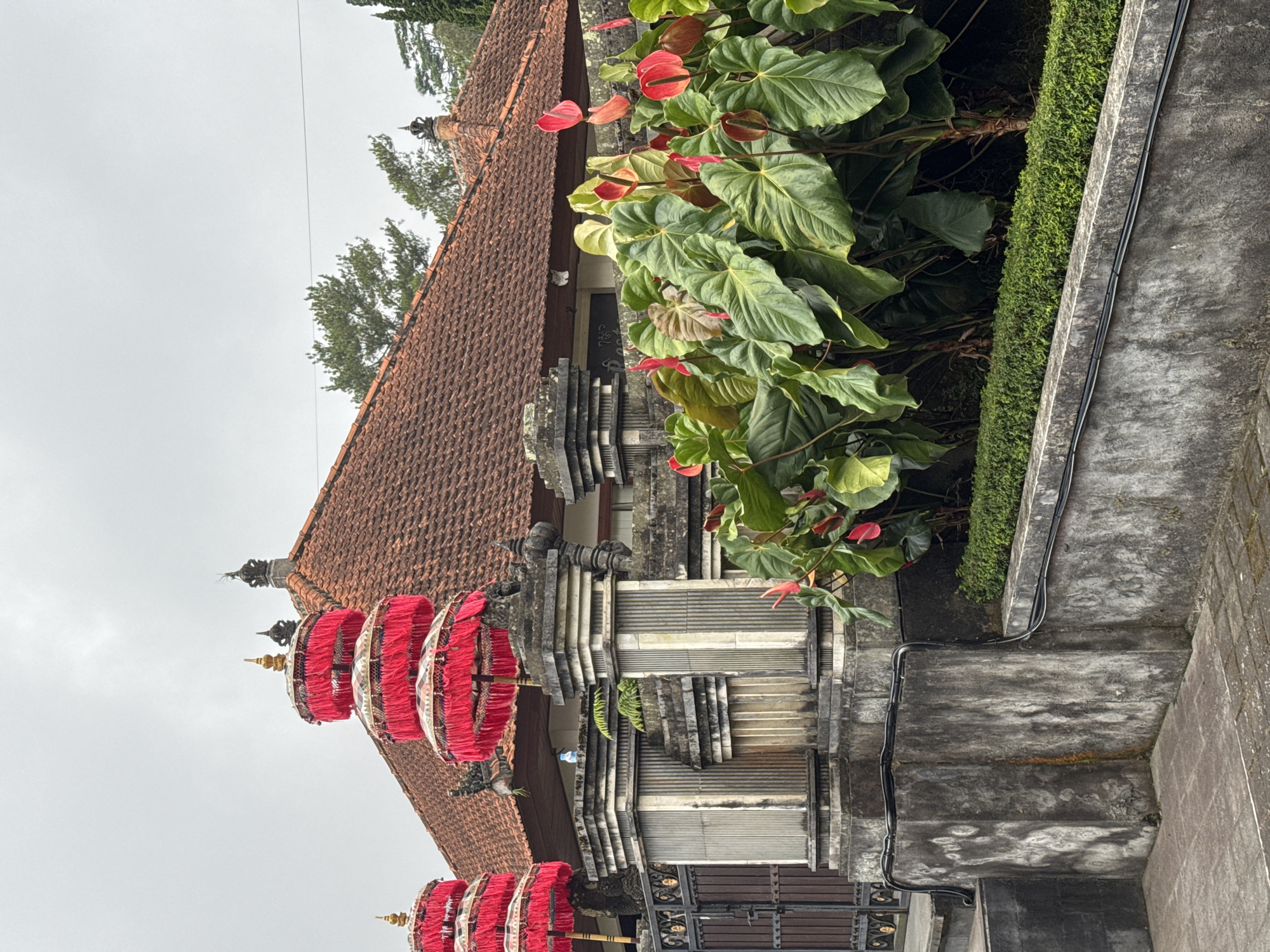 Visitor documents morning tour of Bali's Ulun Danu temple