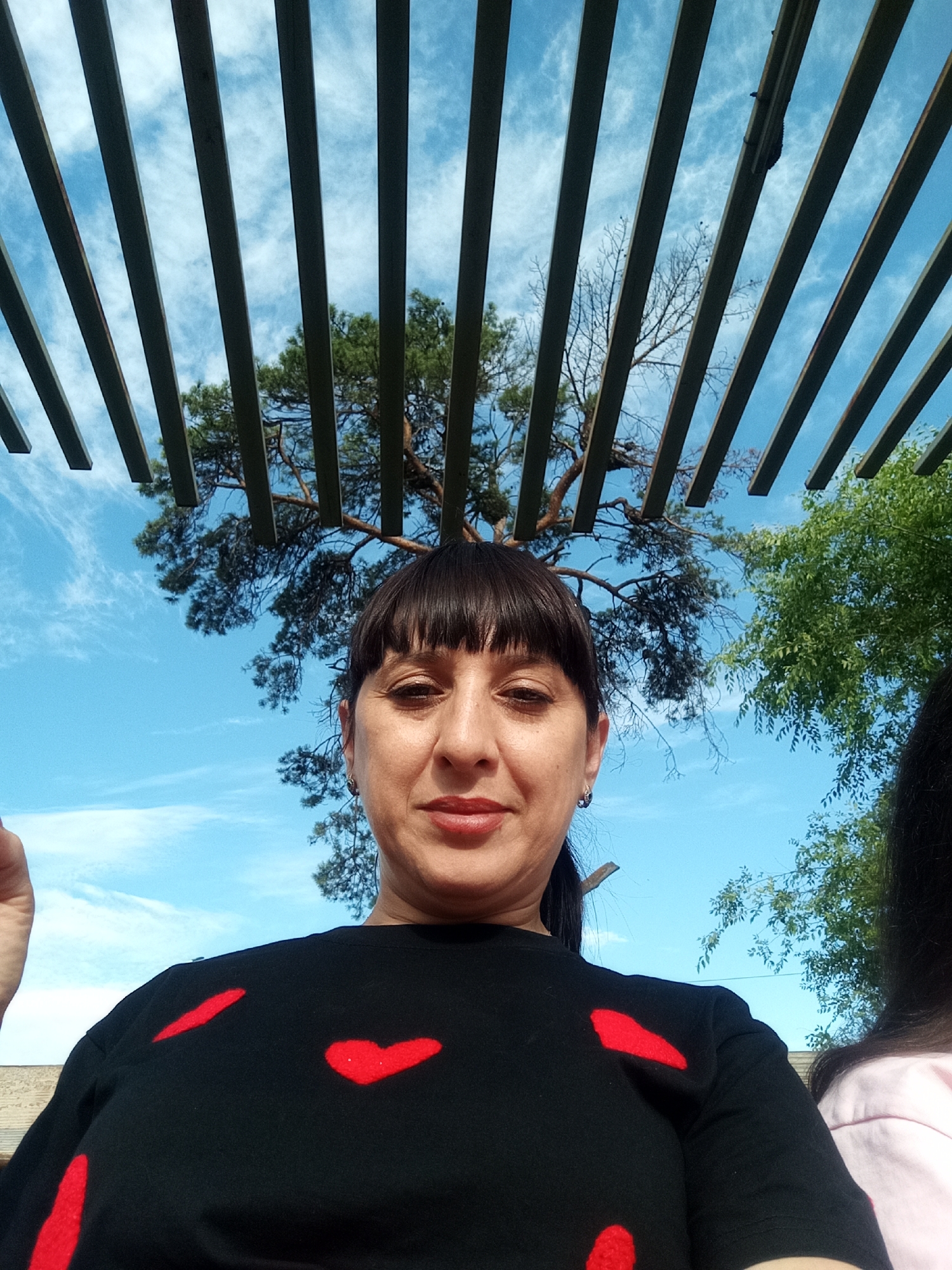 Relaxed park visit in Belogorsk with flowers, benches, and open skies