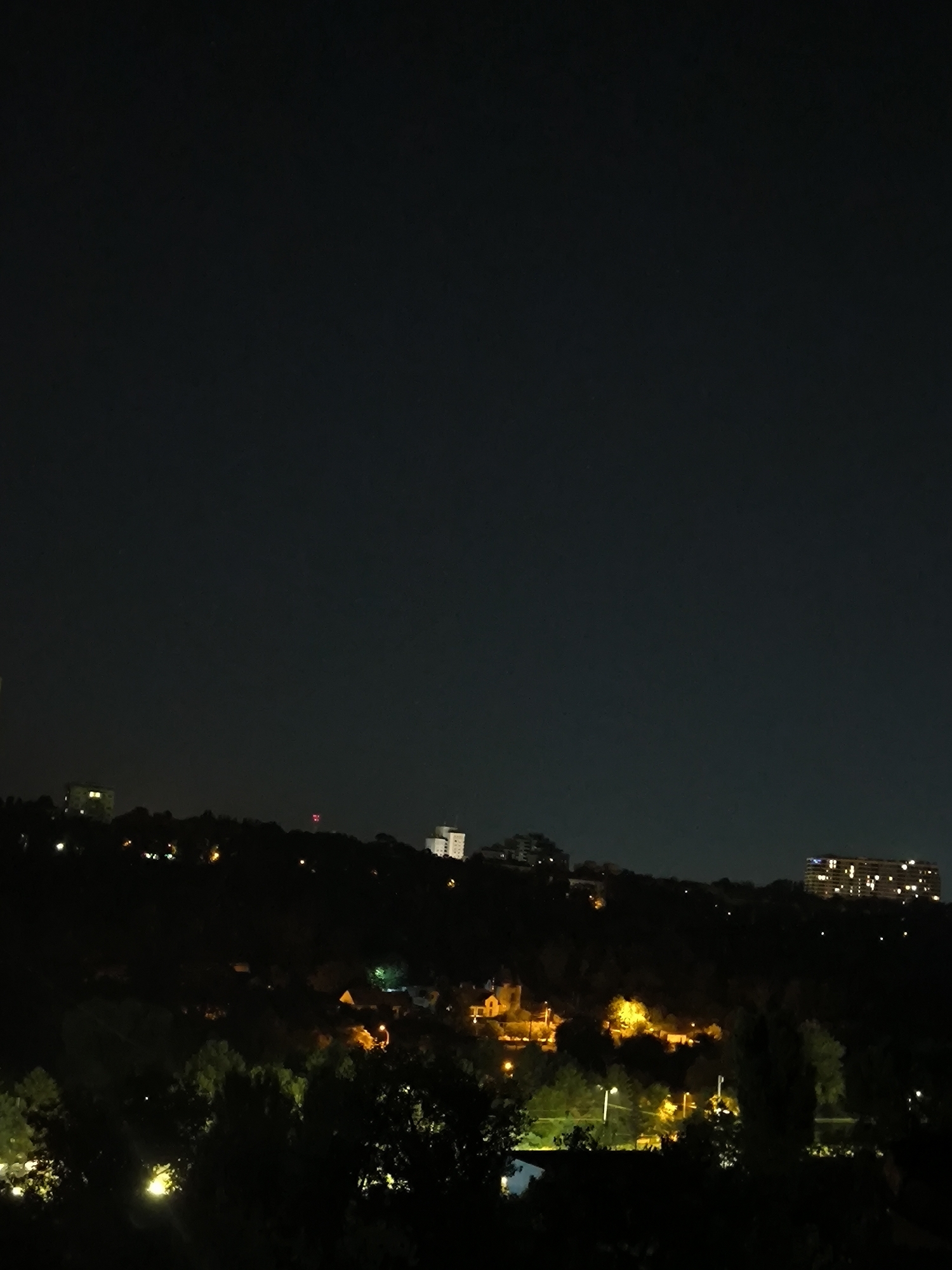 Chișinău residential neighborhoods at night, moon overhead