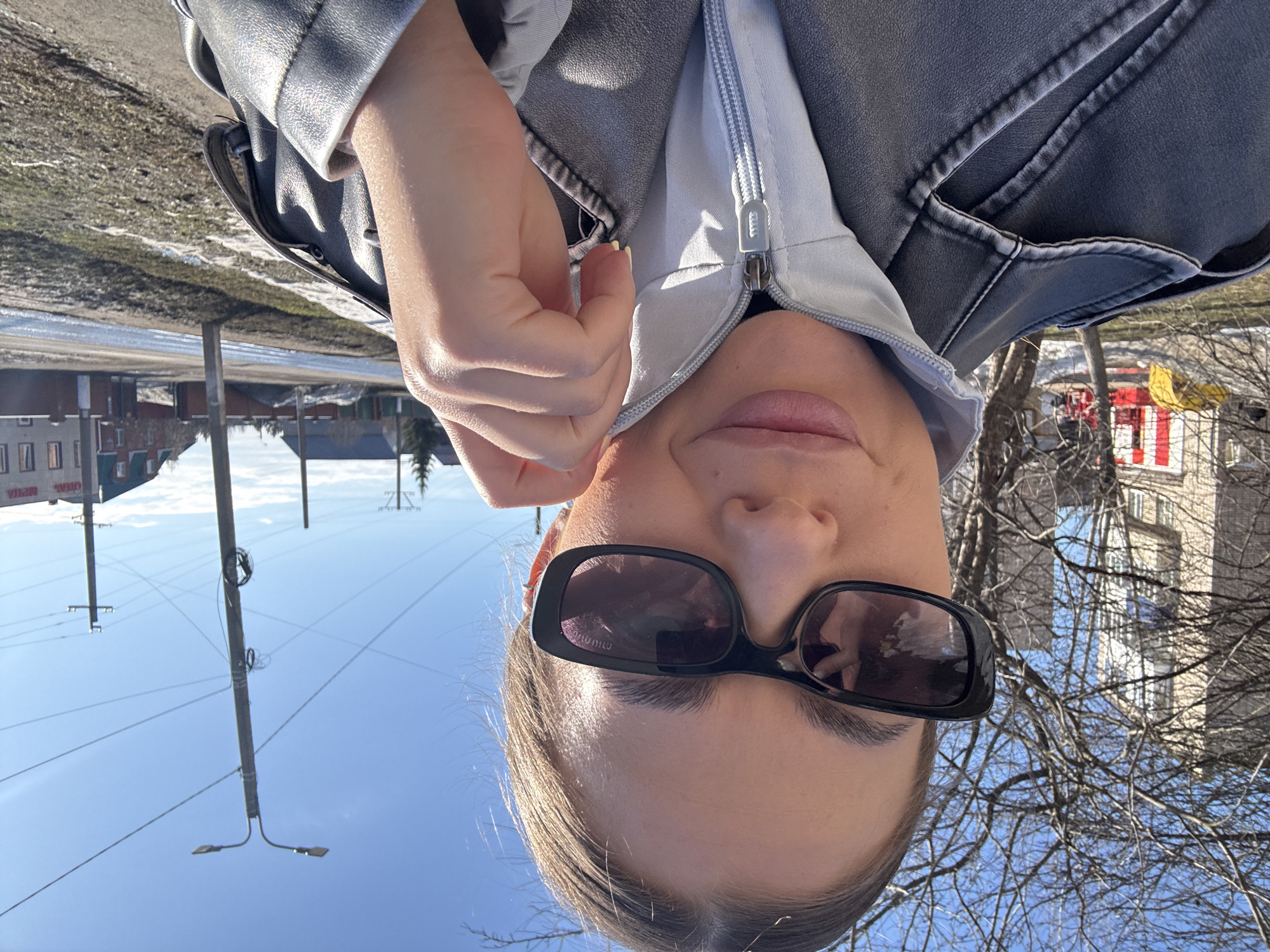 Woman photographed with beverage near playground in Chernushka