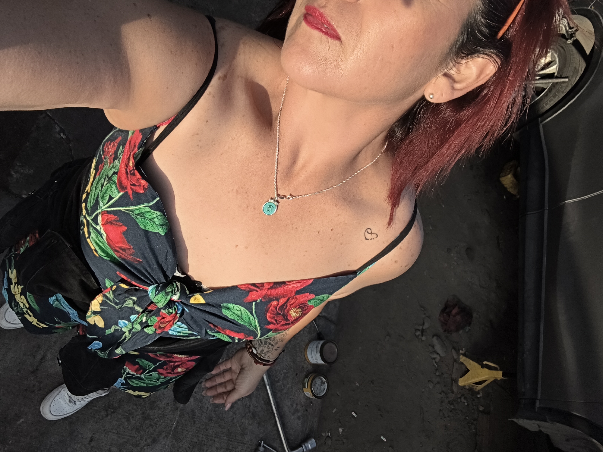 Red-haired woman observed across multiple Arica locations