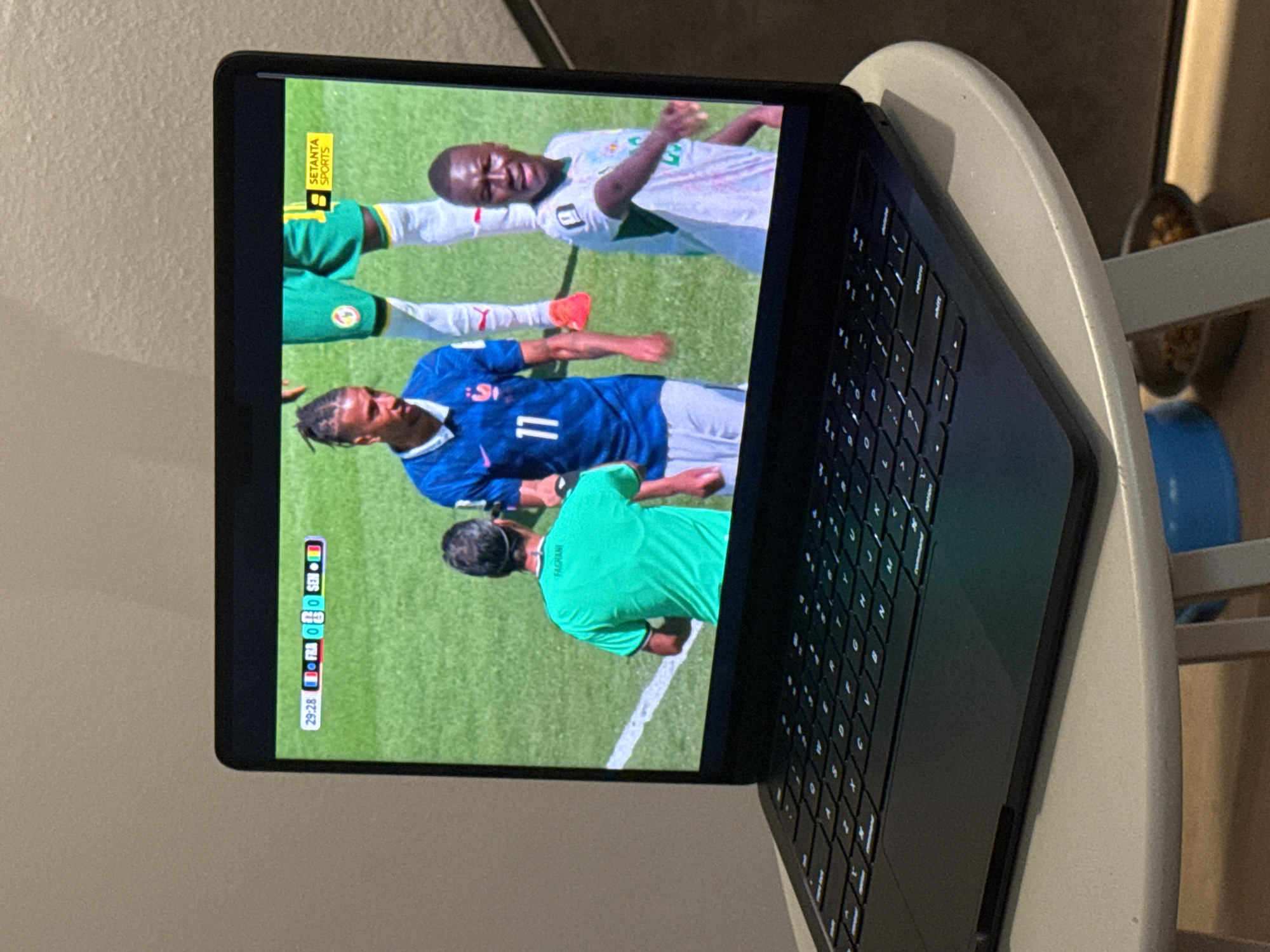 Inside a modern apartment during a soccer match afternoon