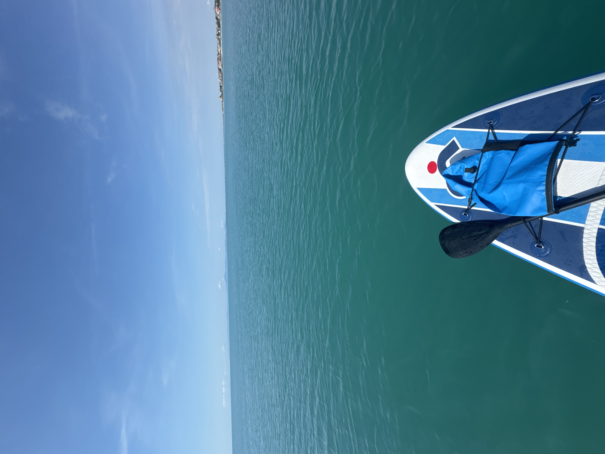 Morning paddleboard session captured in calm turquoise waters