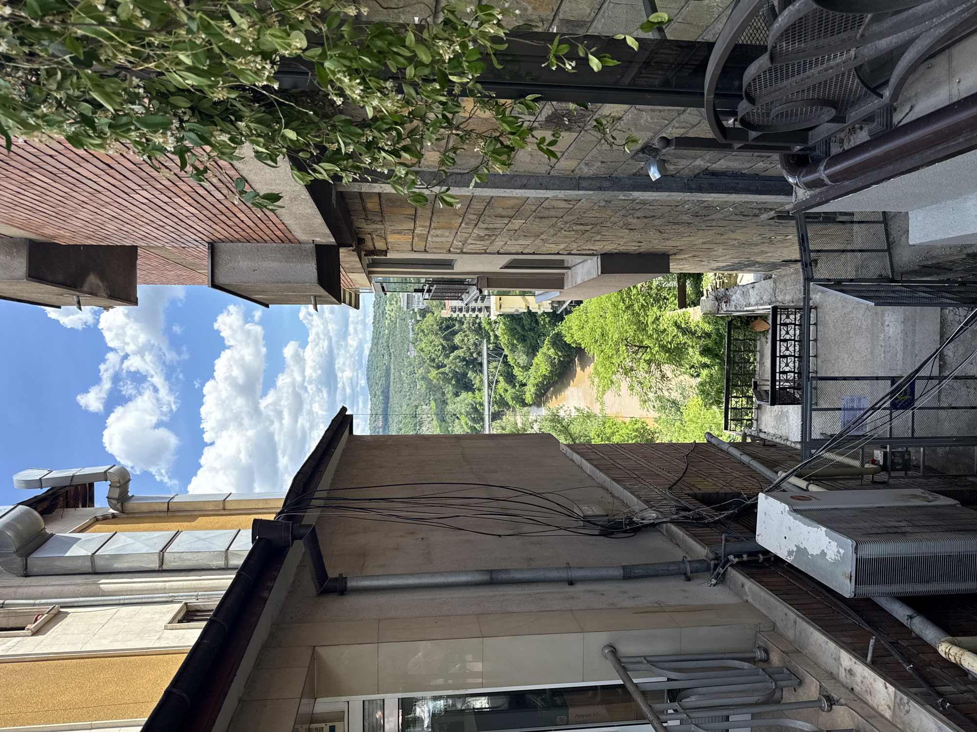 Tourist explores historic Veliko Tarnovo, capturing everyday city scenes