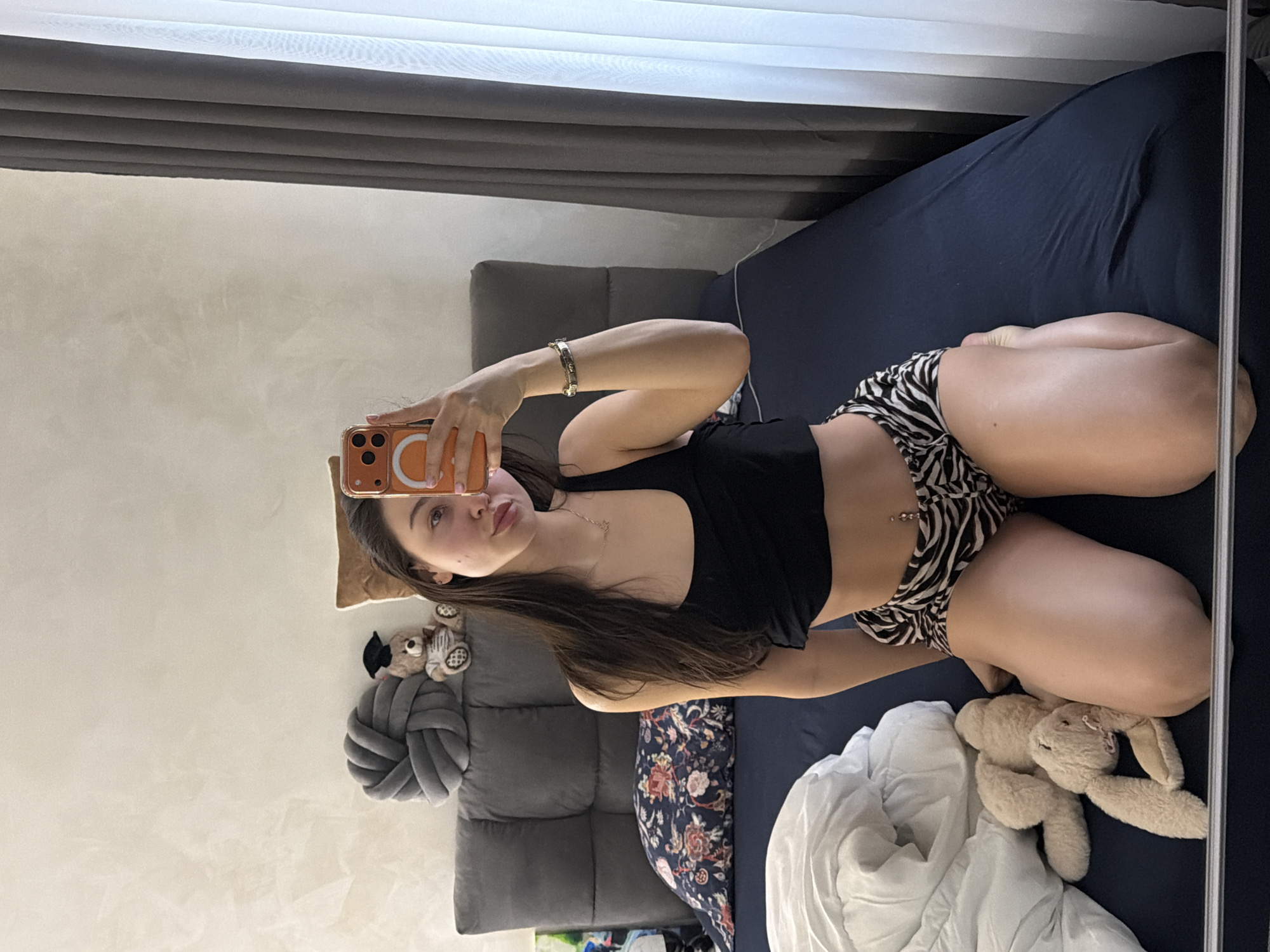 Woman takes multiple bedroom selfies in Pernik, Bulgaria