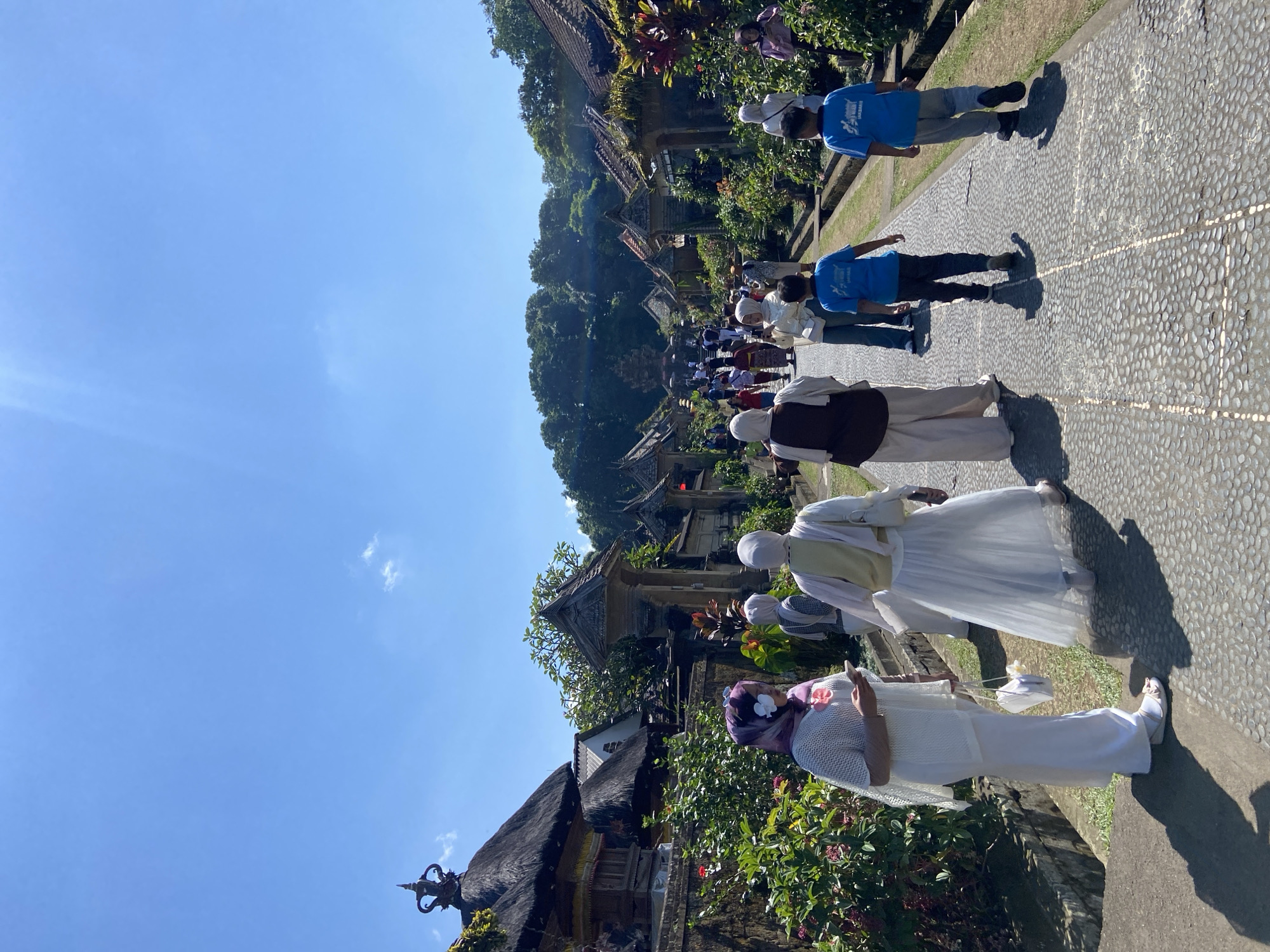 Morning at Kehen Temple, Bangli — stone shrines and traditional dress